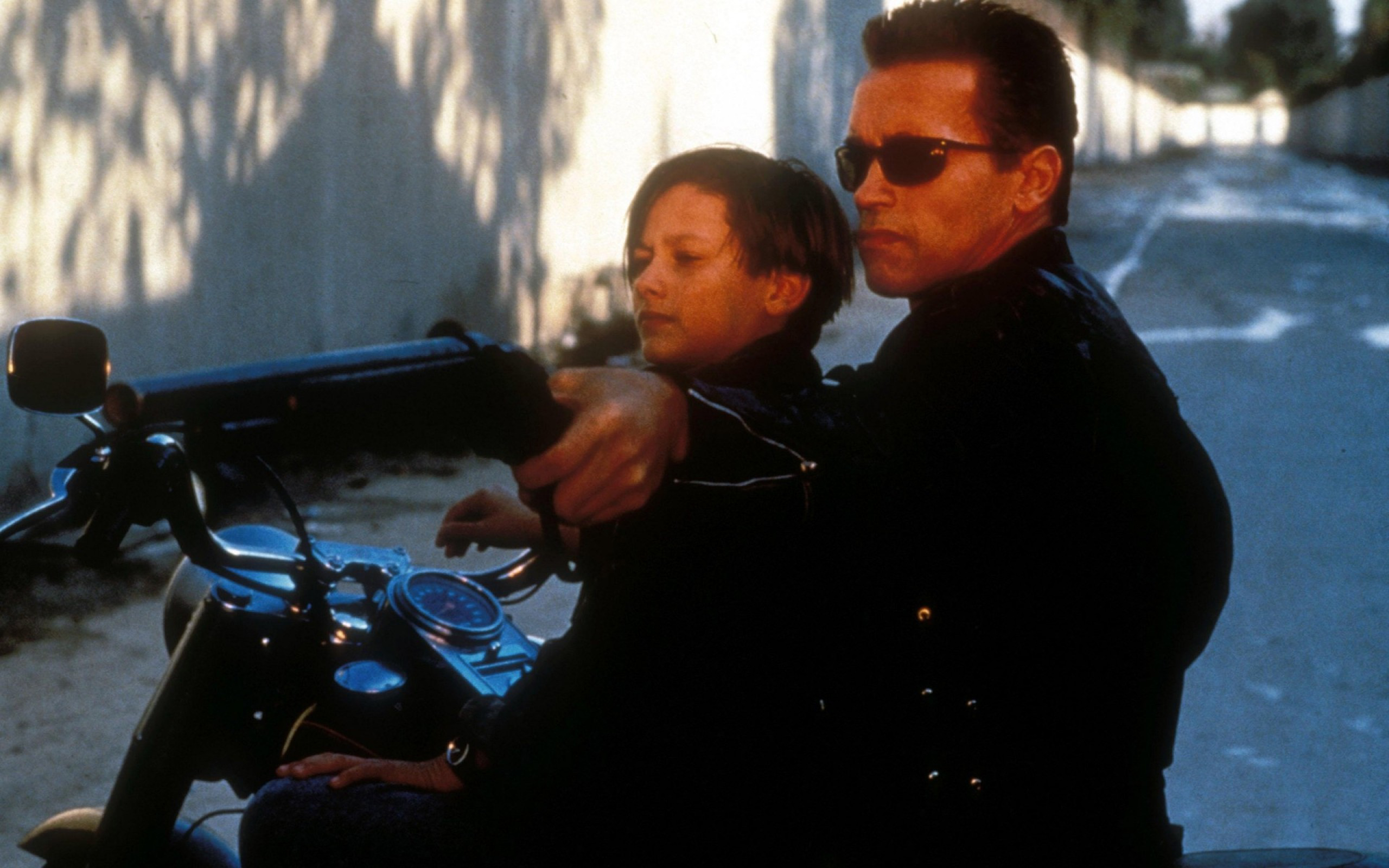 The Terminator T-800 and John Connor on a motorcycle HD Wallpaper