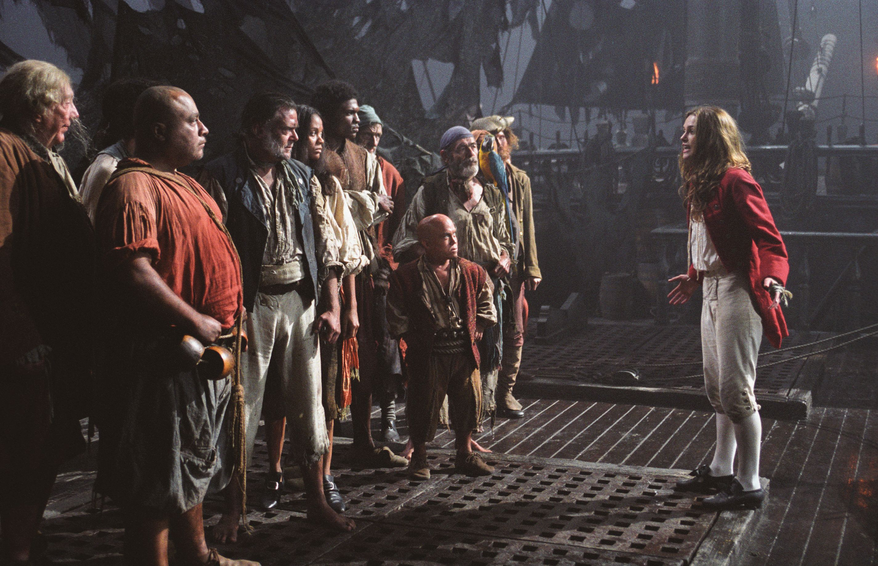 Elizabeth Swann and pirates on a ship deck HD Wallpaper