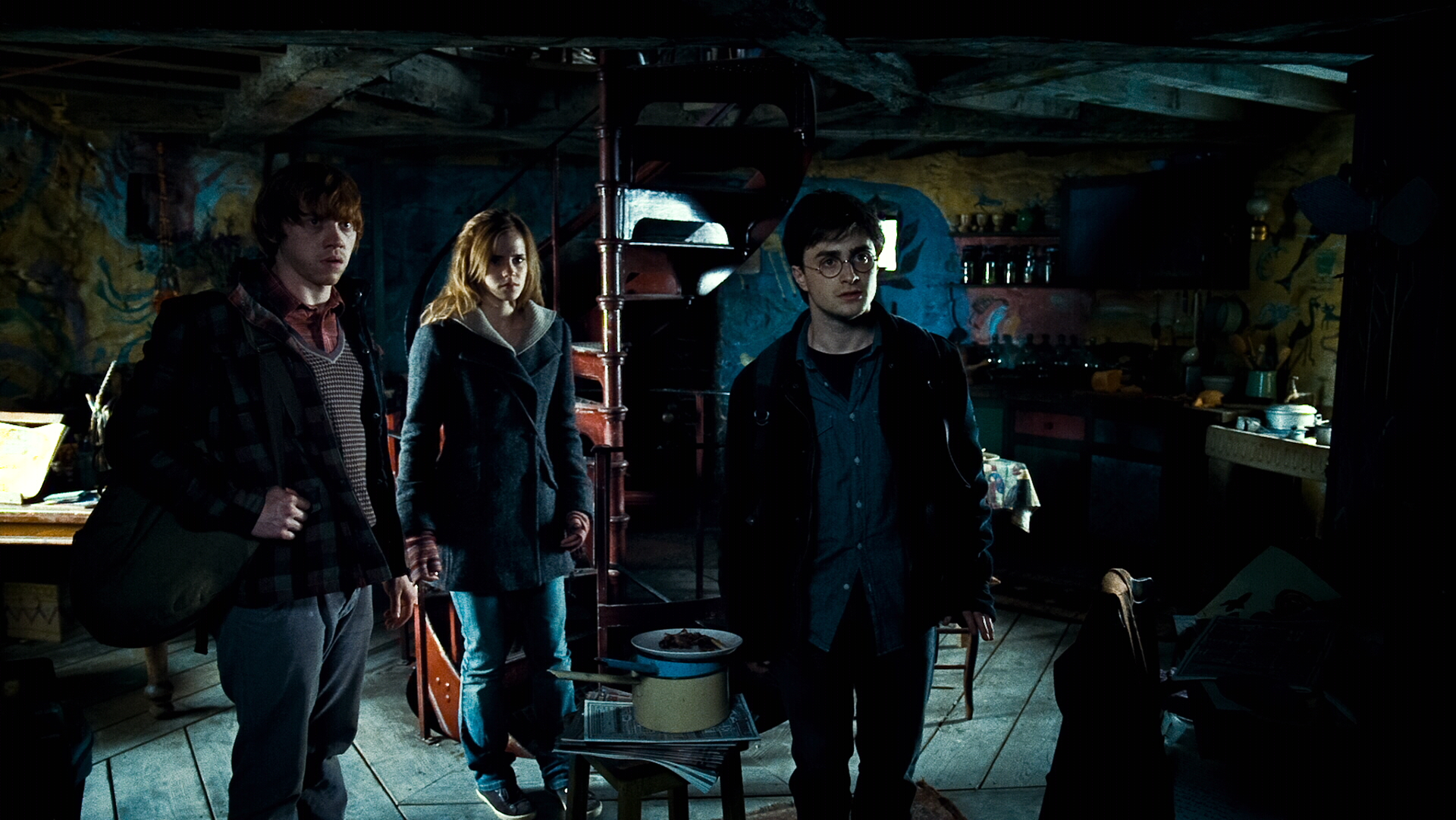 Ron Weasley and friends in a dimly lit room HD Wallpaper
