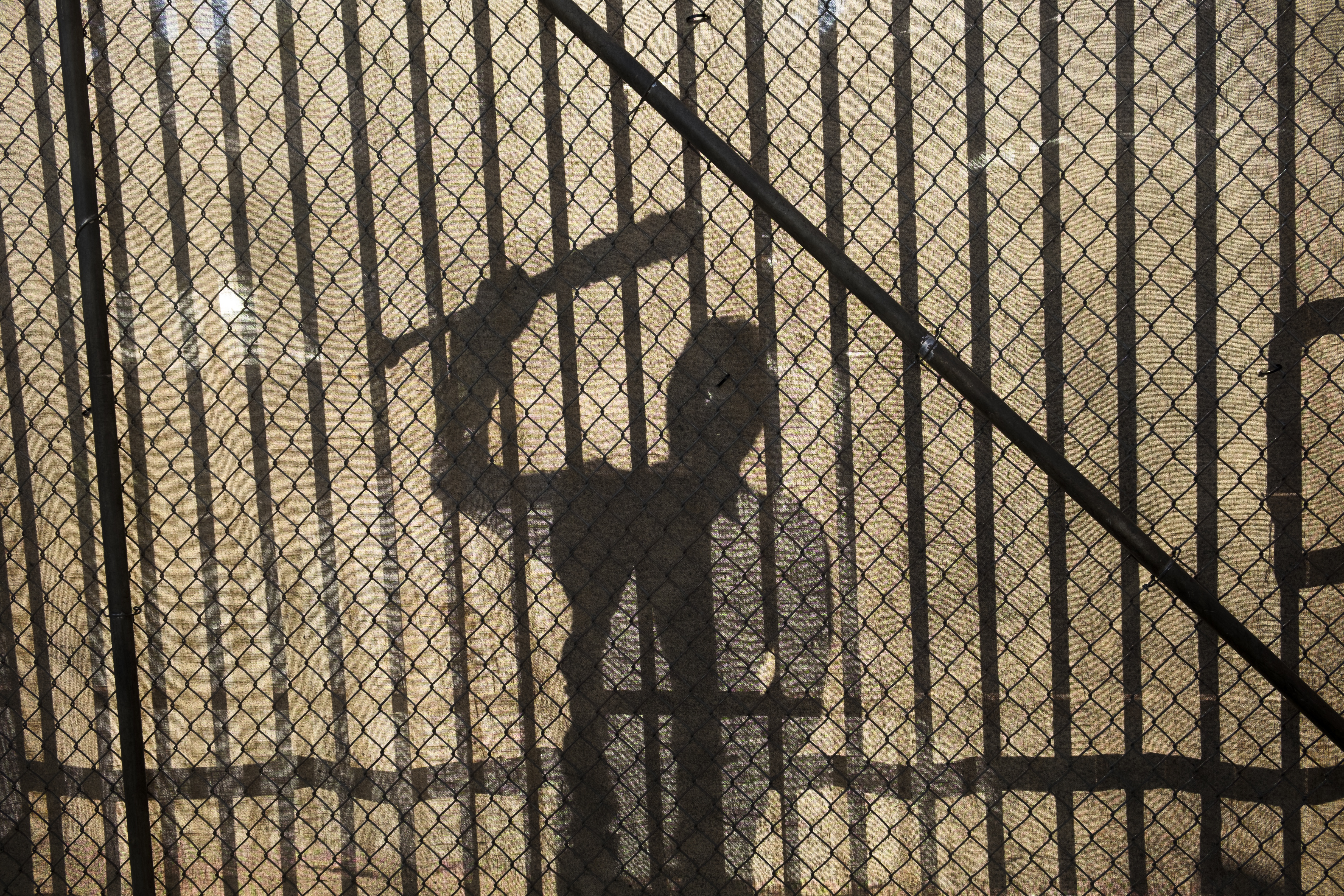 Shadow of Negan from The Walking Dead holding a bat HD Wallpaper