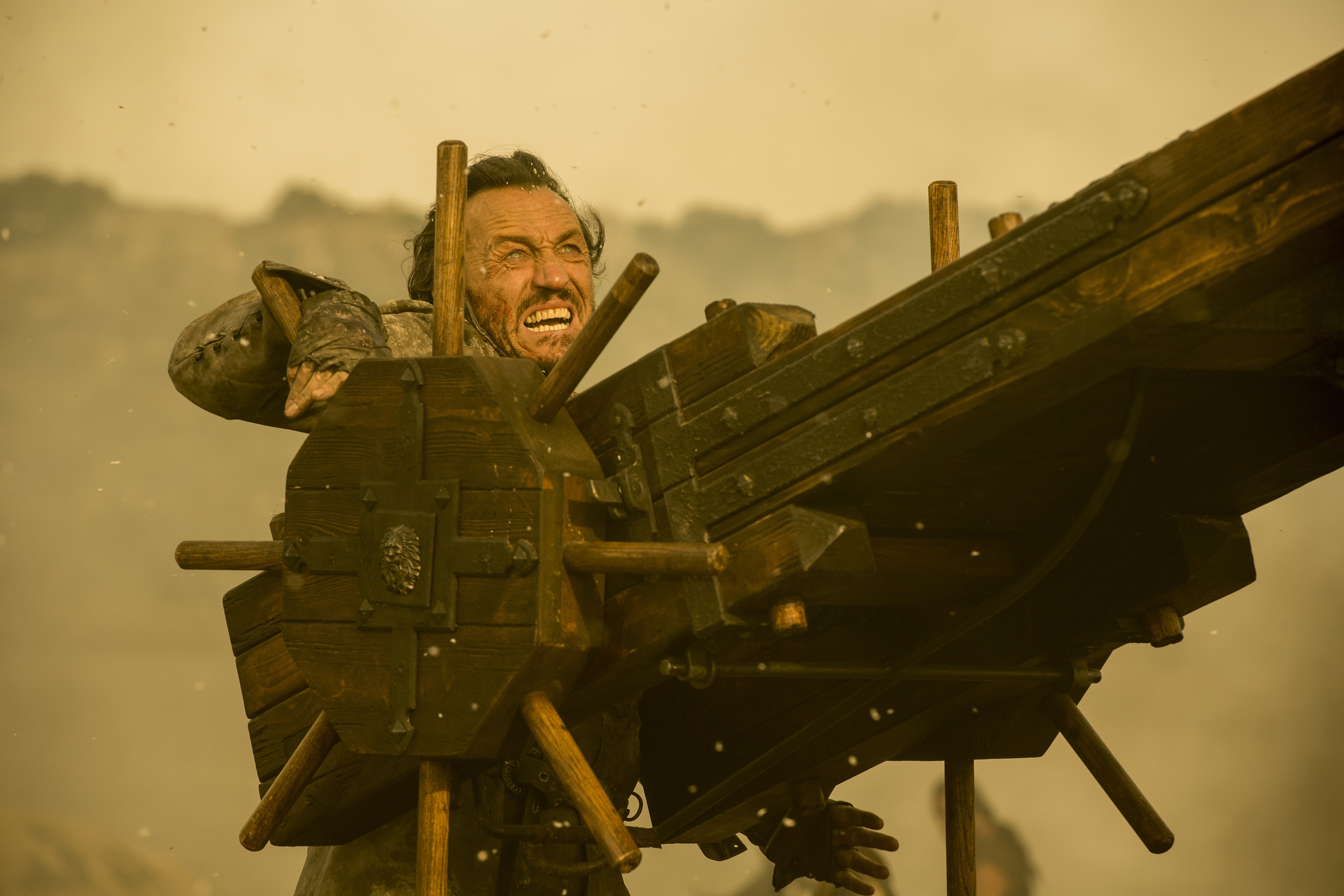 Bronn from Game of Thrones operating a siege weapon HD Wallpaper
