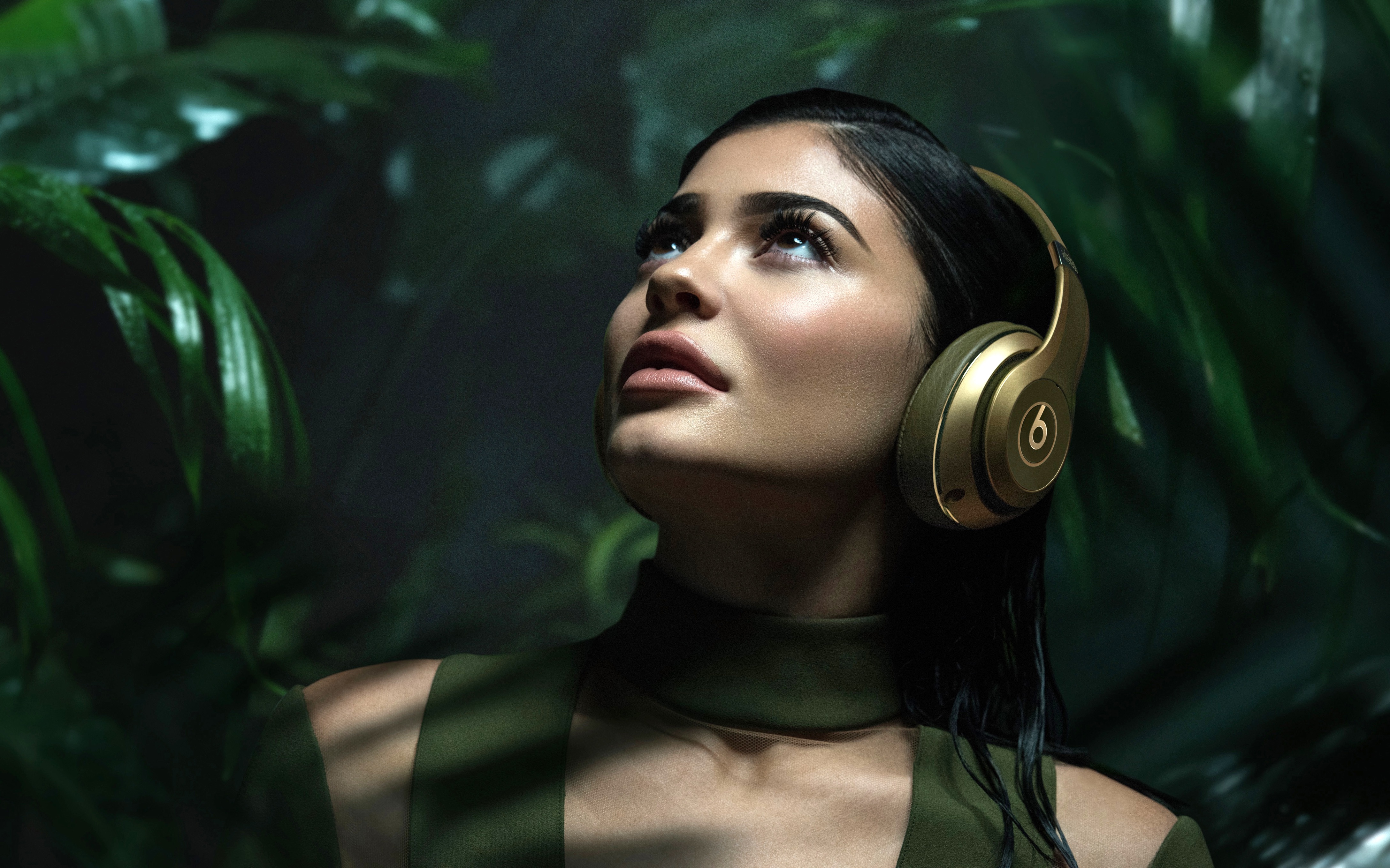Kylie Jenner wearing Beats headphones in jungle HD Wallpaper