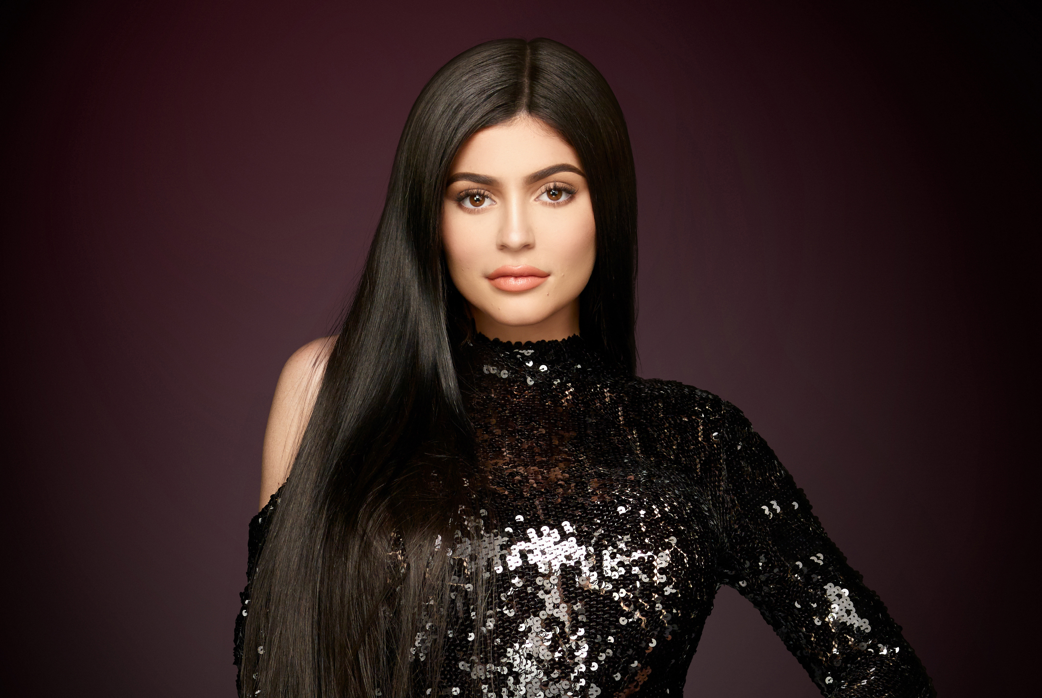 Kylie Jenner in a black sequined dress HD Wallpaper