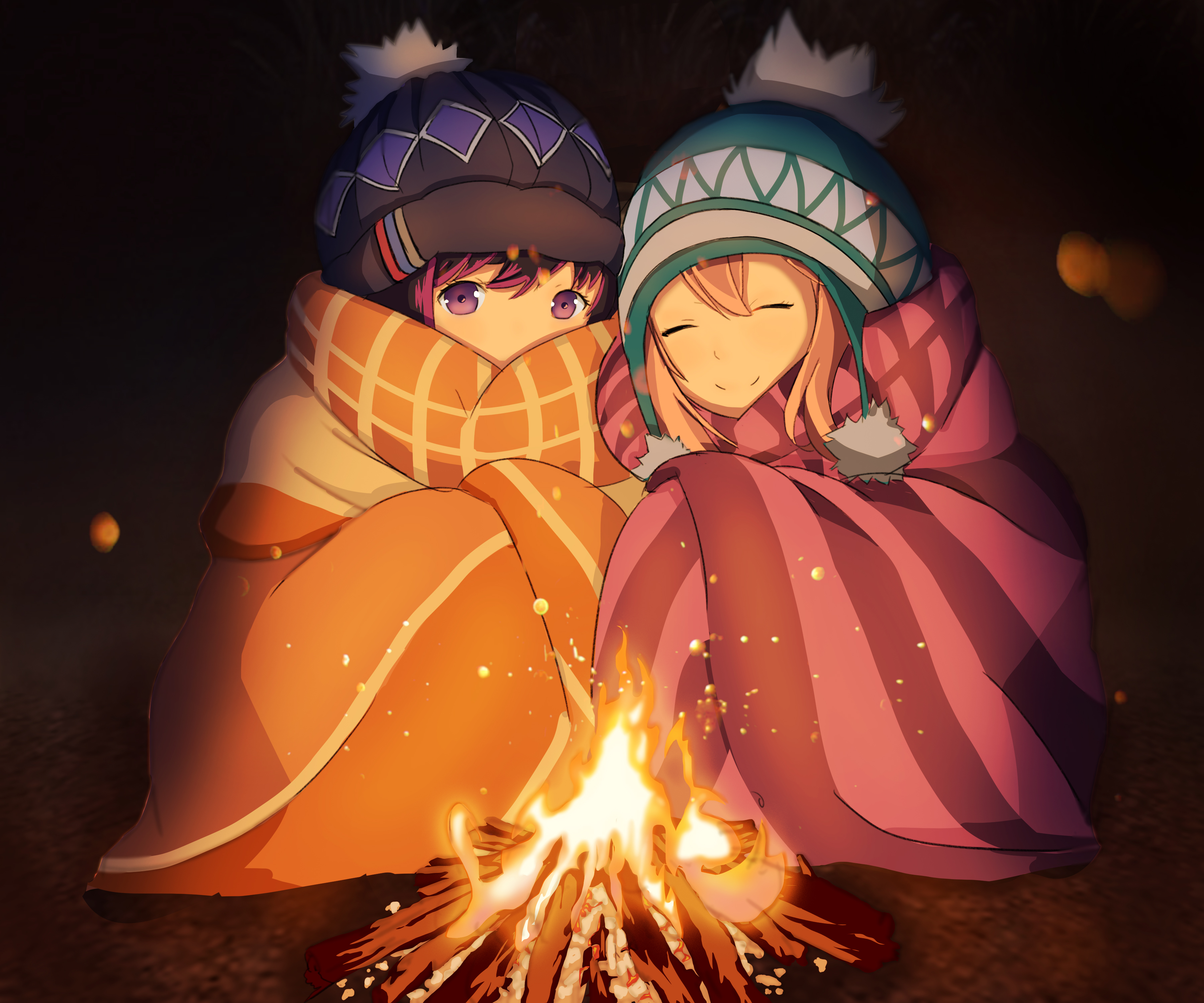 Two girls wrapped in blankets by a campfire HD Wallpaper