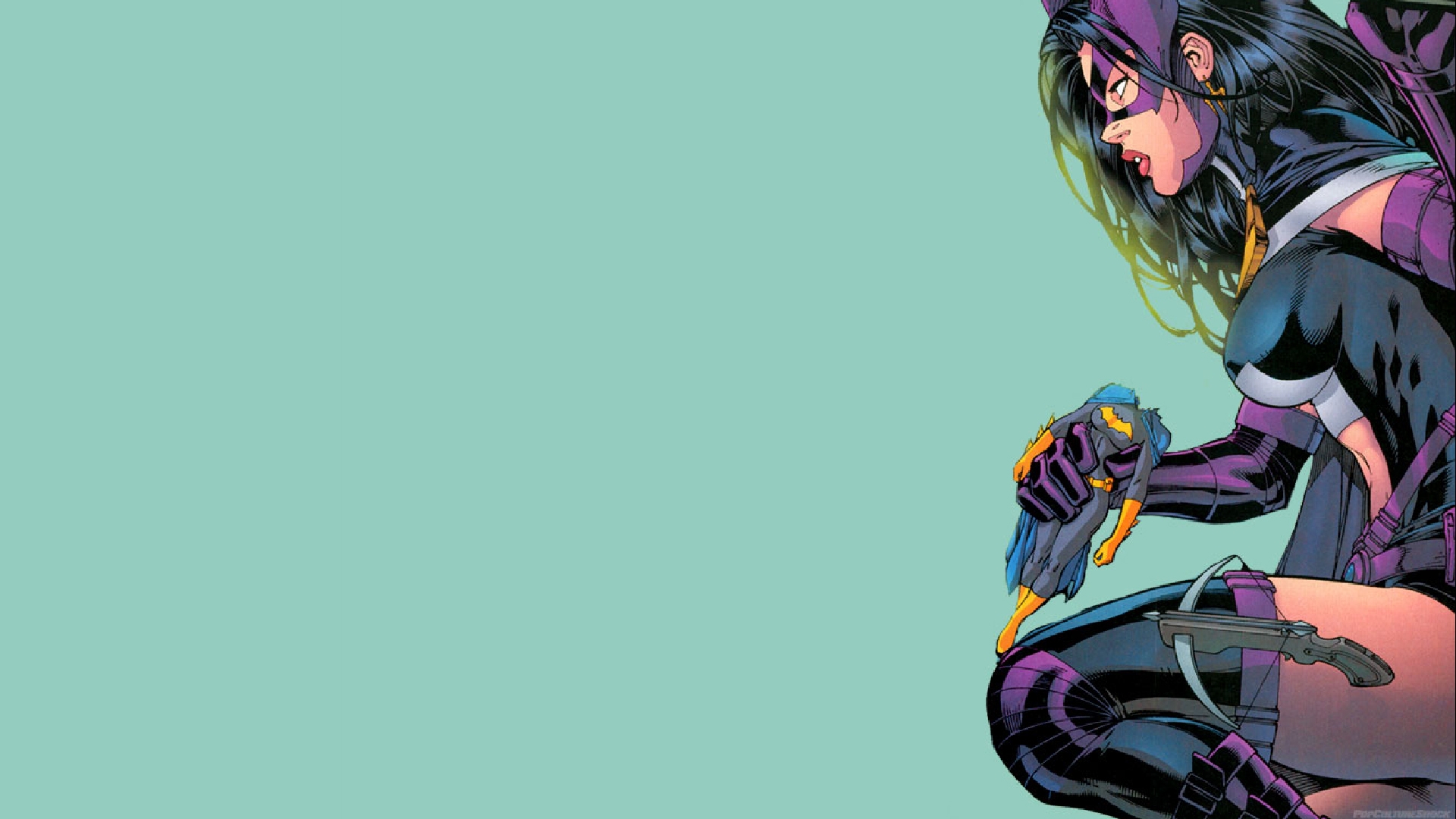 Huntress from DC Comics holding a small Batman figure HD Wallpaper