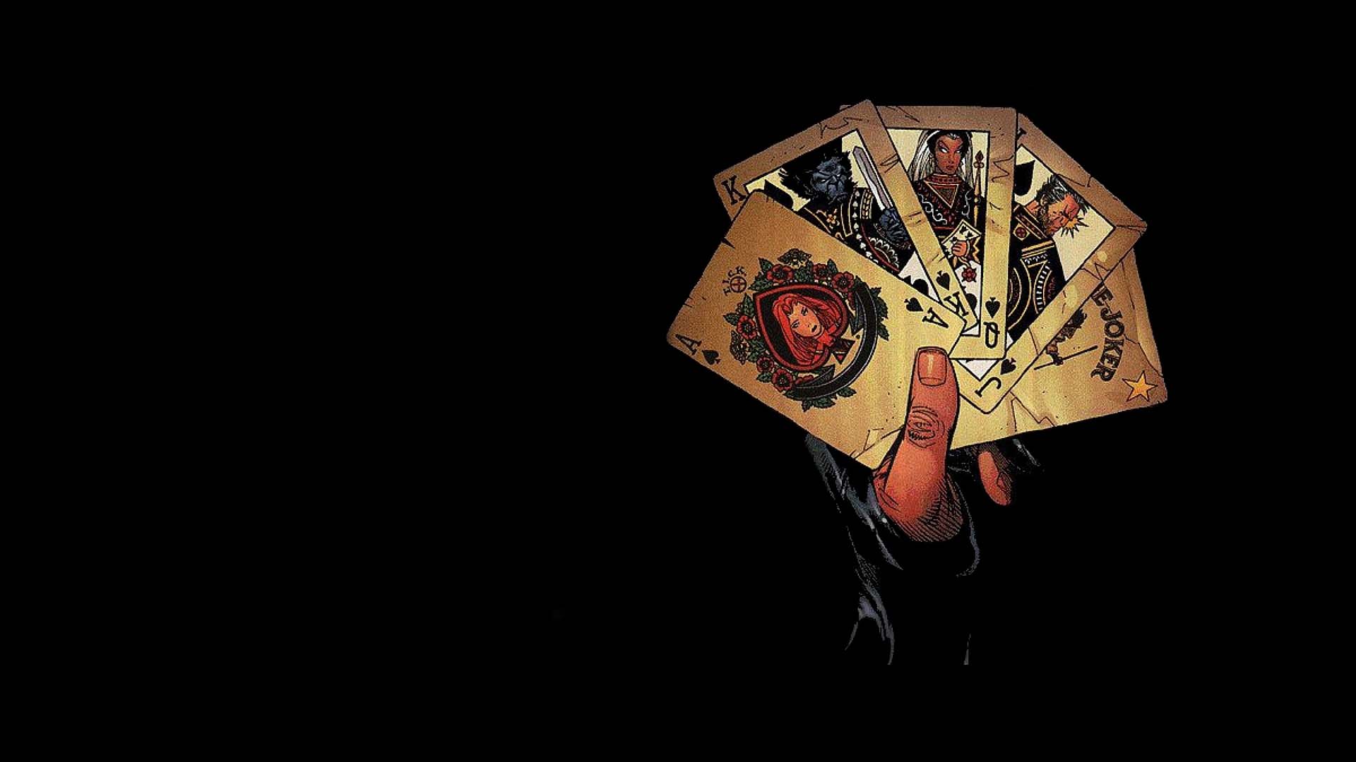 Gambit holding playing cards HD Wallpaper