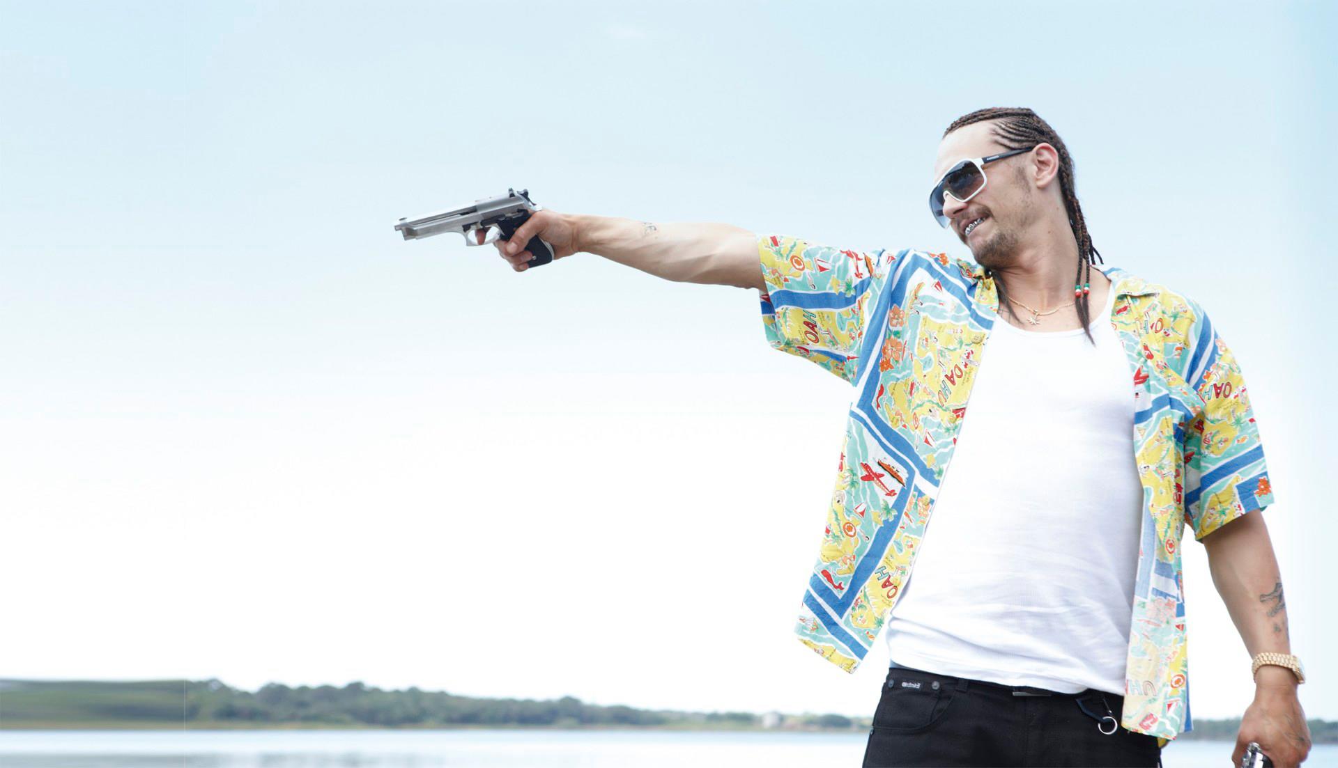 James Franco holding a gun HD Wallpaper