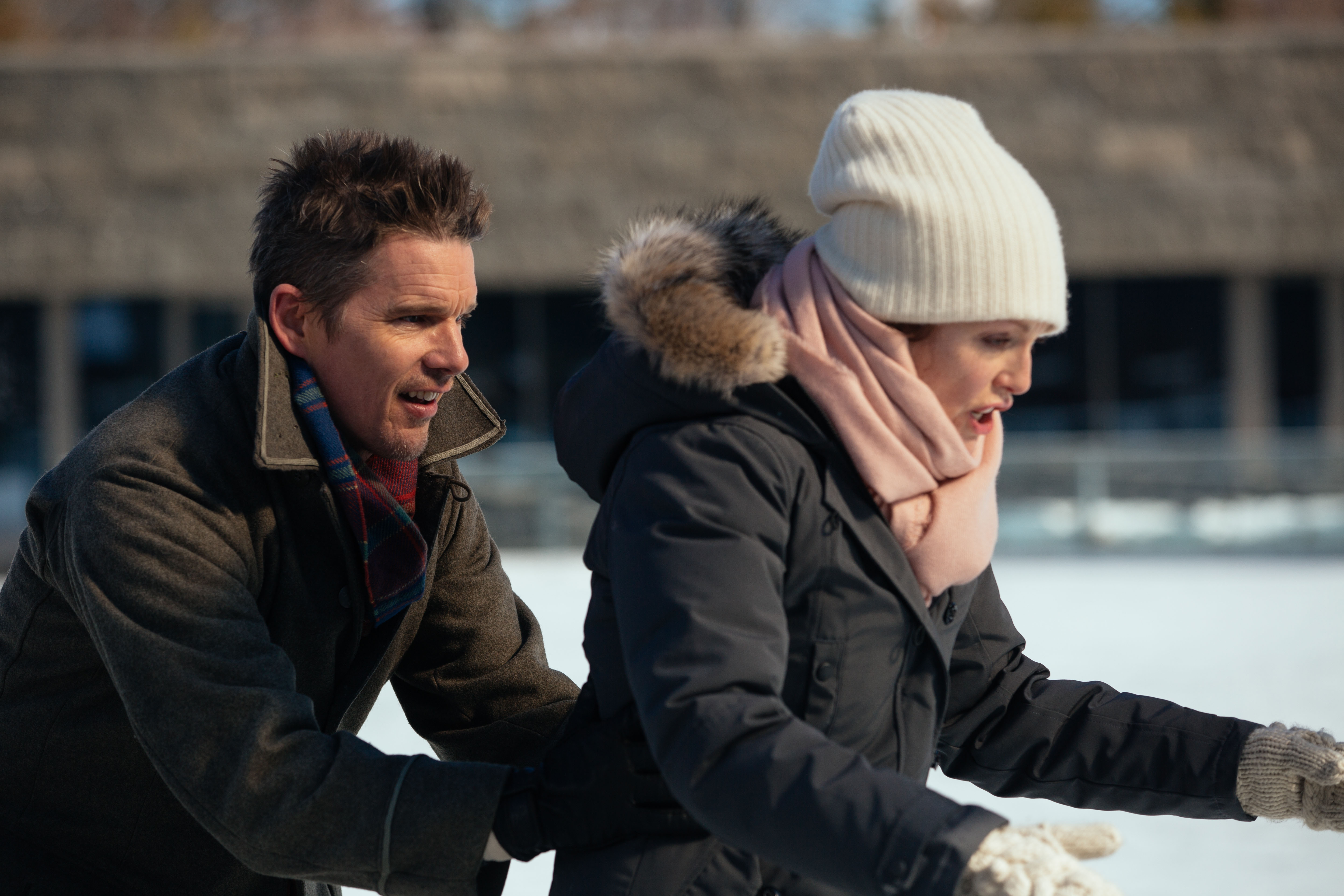 Ethan Hawke and woman ice skating HD Wallpaper