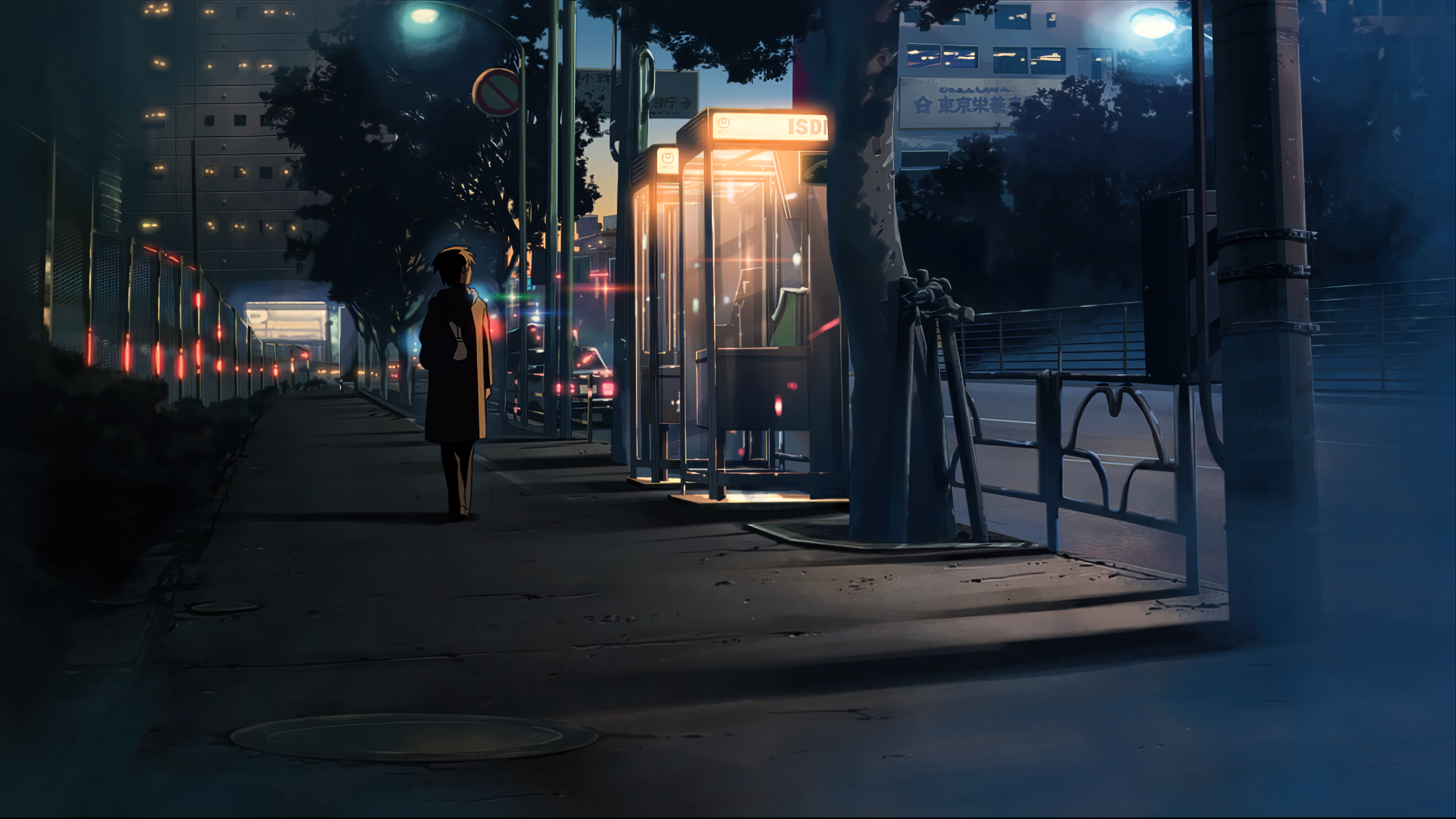 Person walking on a city street at night HD Wallpaper