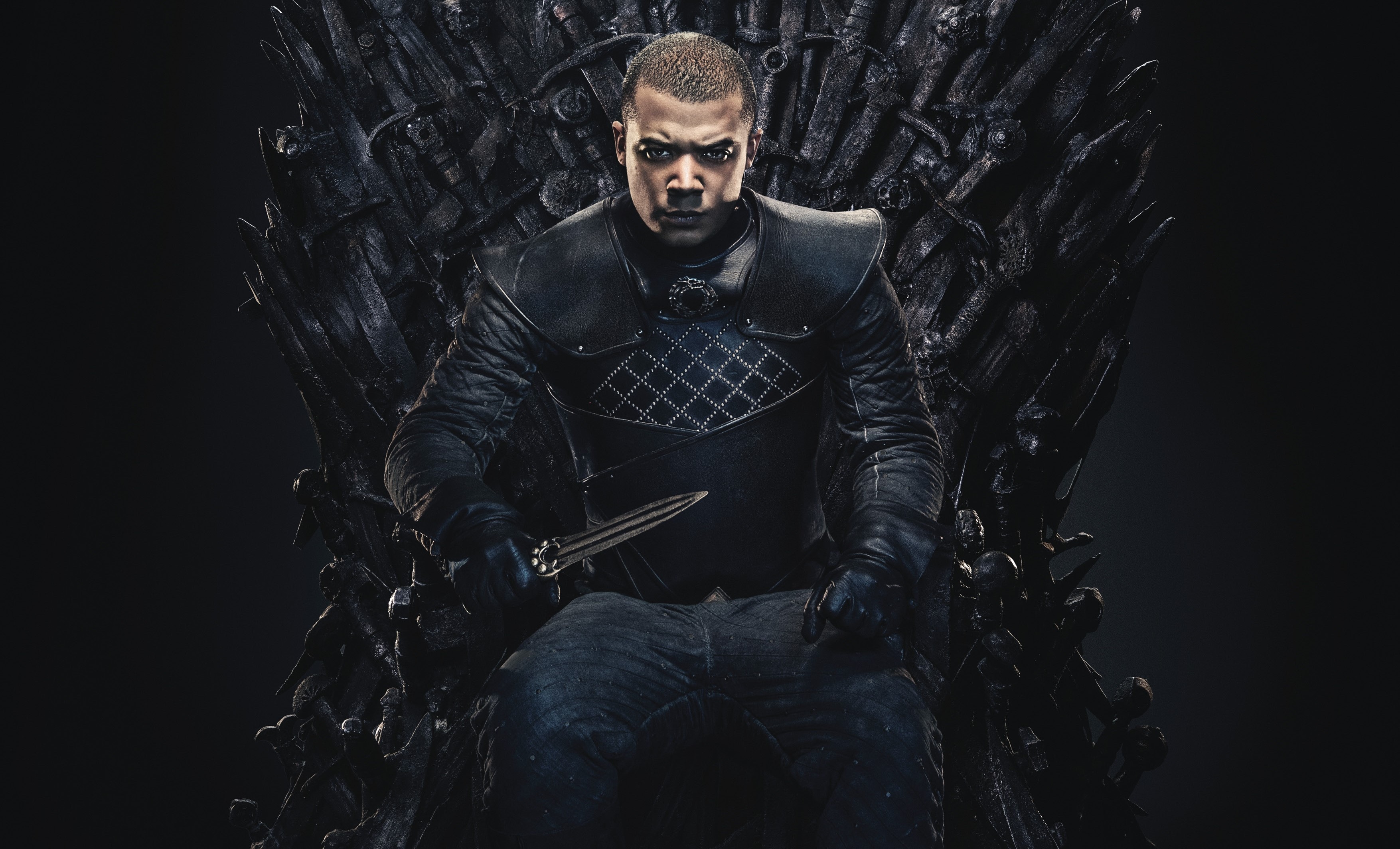 Grey Worm from Game of Thrones sitting on the Iron Throne HD Wallpaper