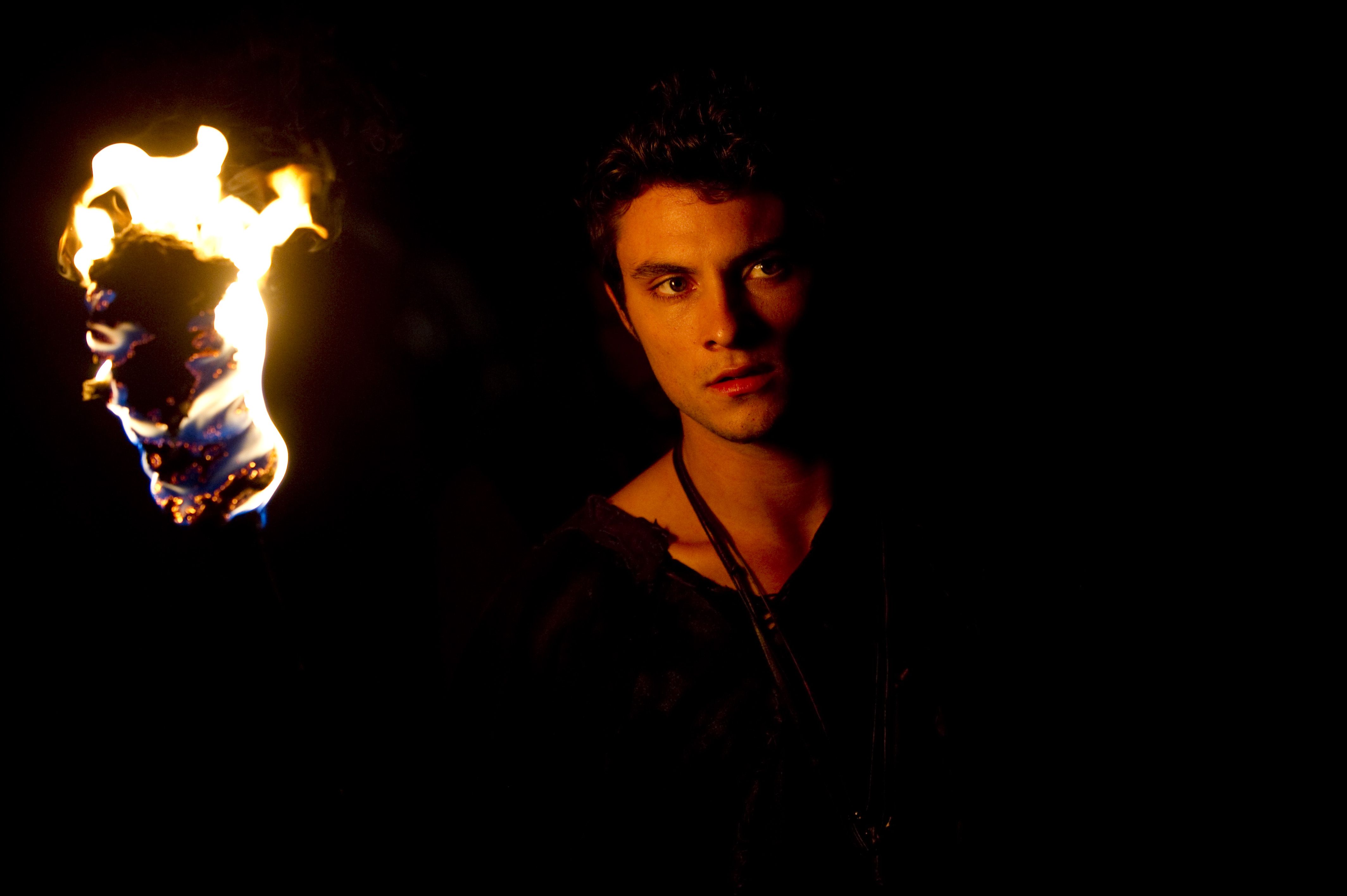 Man holding a torch HD Wallpaper