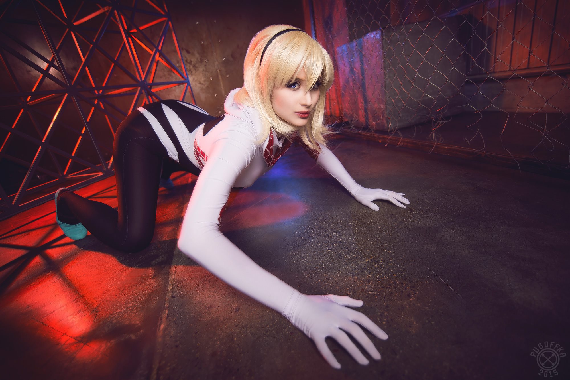 Gwen Stacy in Spider-Gwen costume on the floor HD Wallpaper