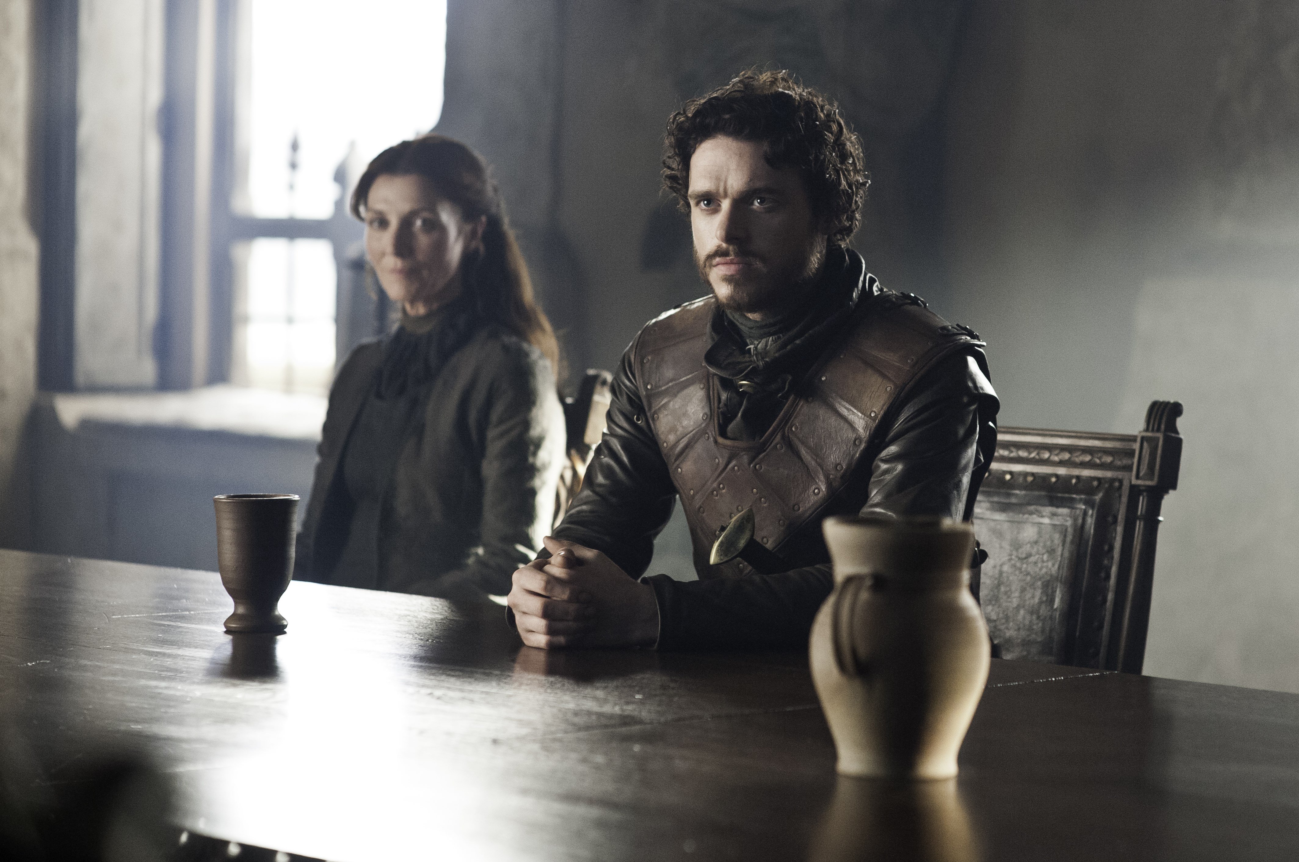 Catelyn Stark and Robb Stark sitting at a table HD Wallpaper