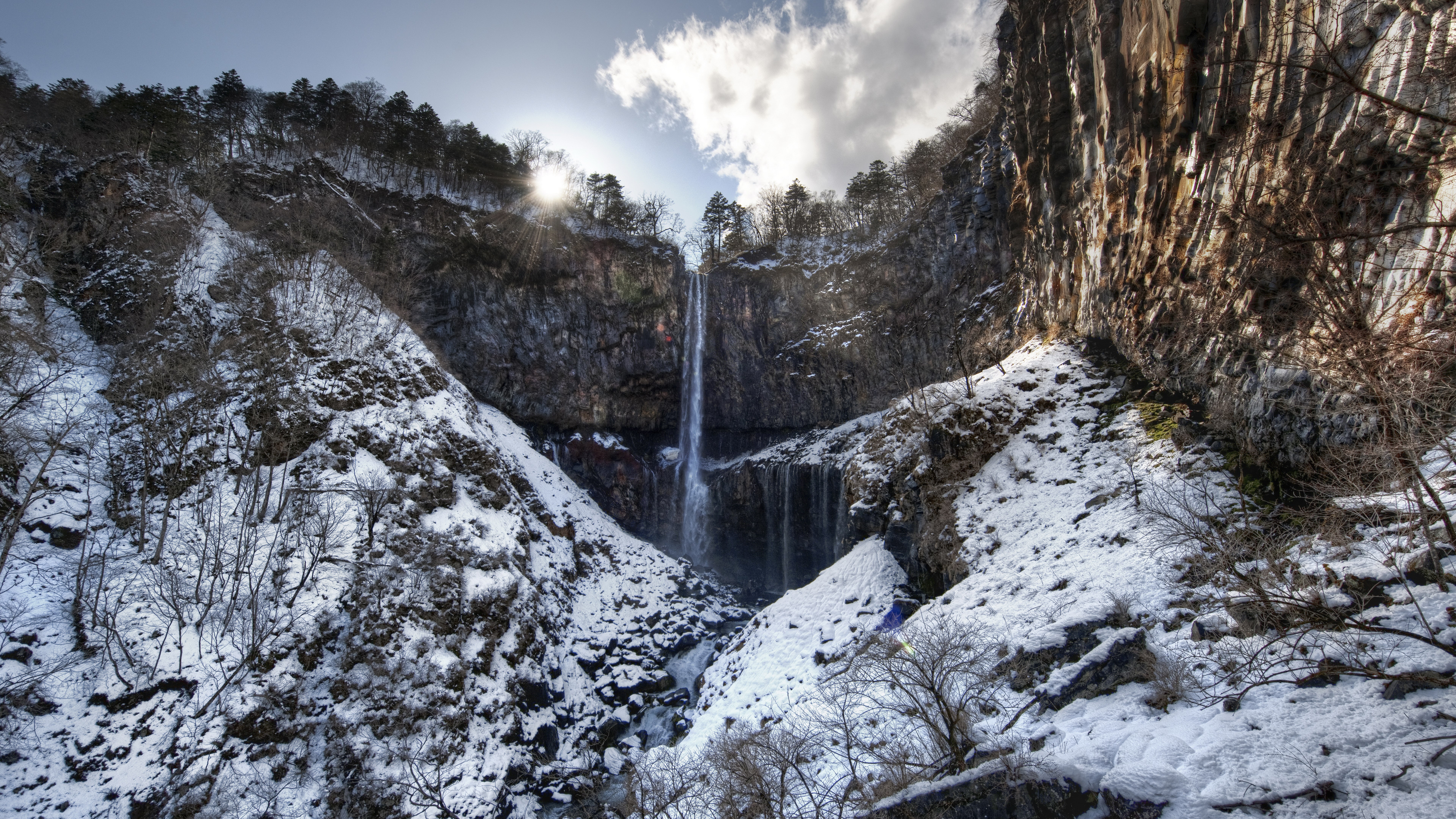 Waterfall in a snowy canyon with trees HD Wallpaper