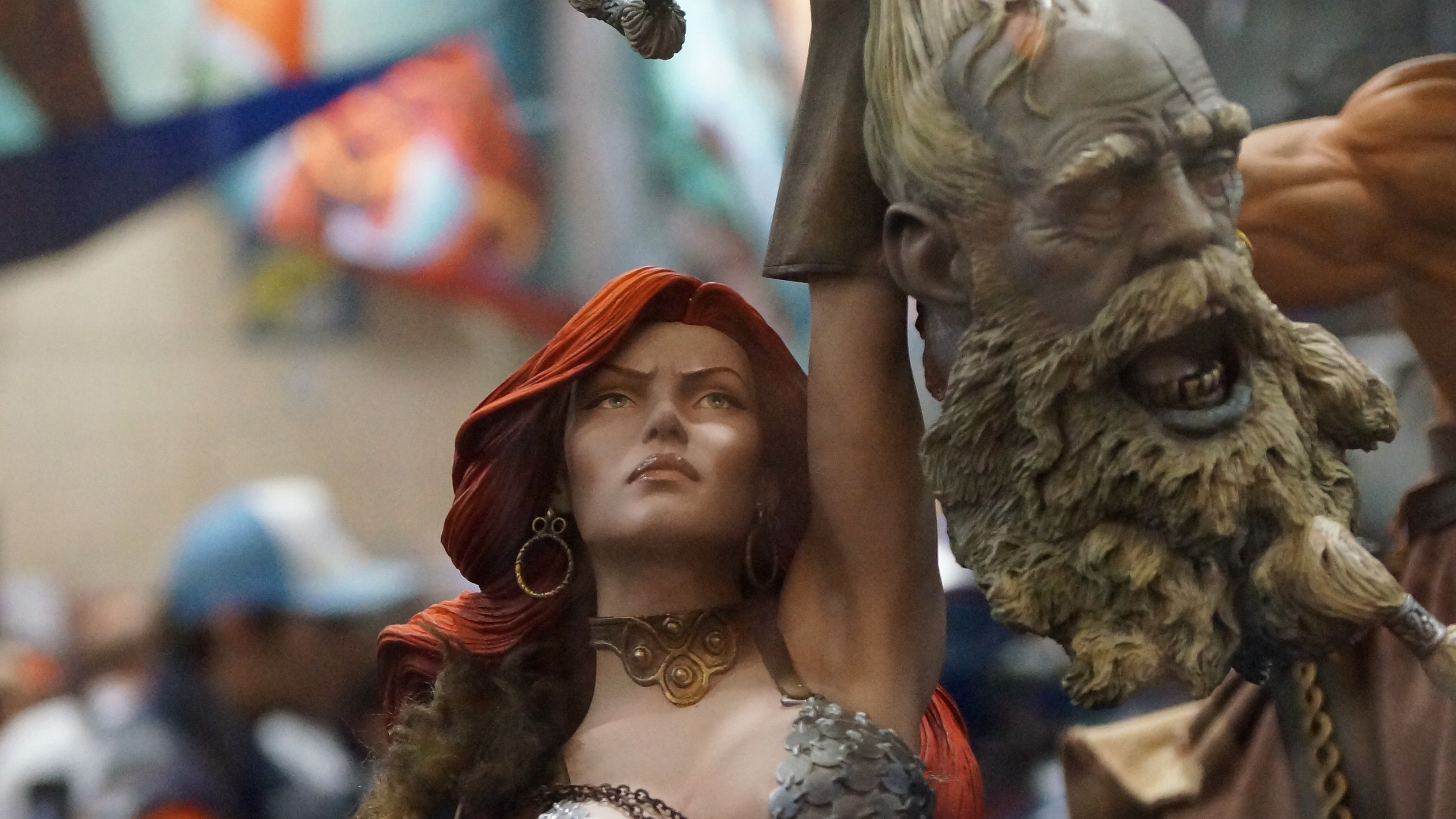 Red Sonja holding a severed head HD Wallpaper