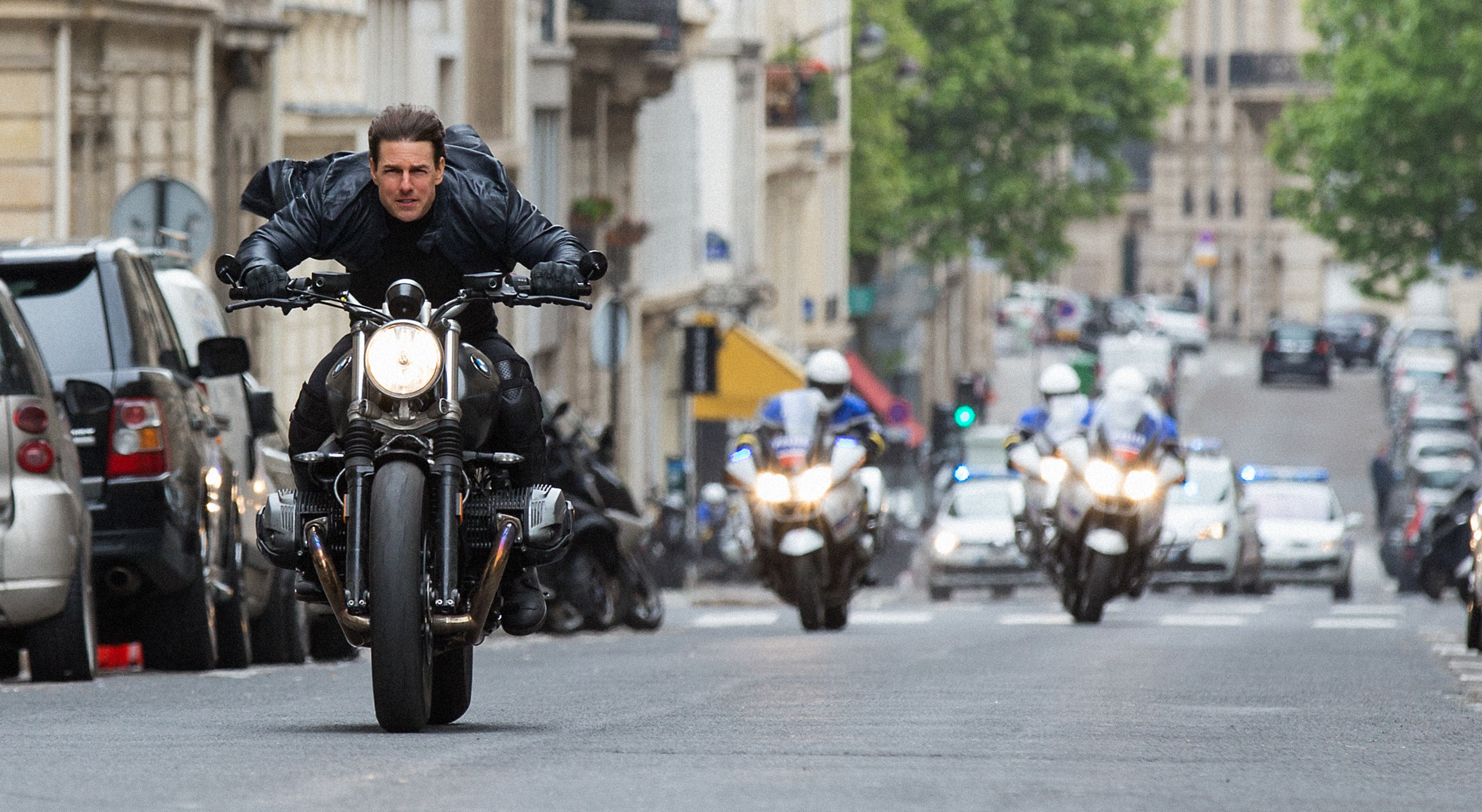 Ethan Hunt on a motorcycle in Paris HD Wallpaper