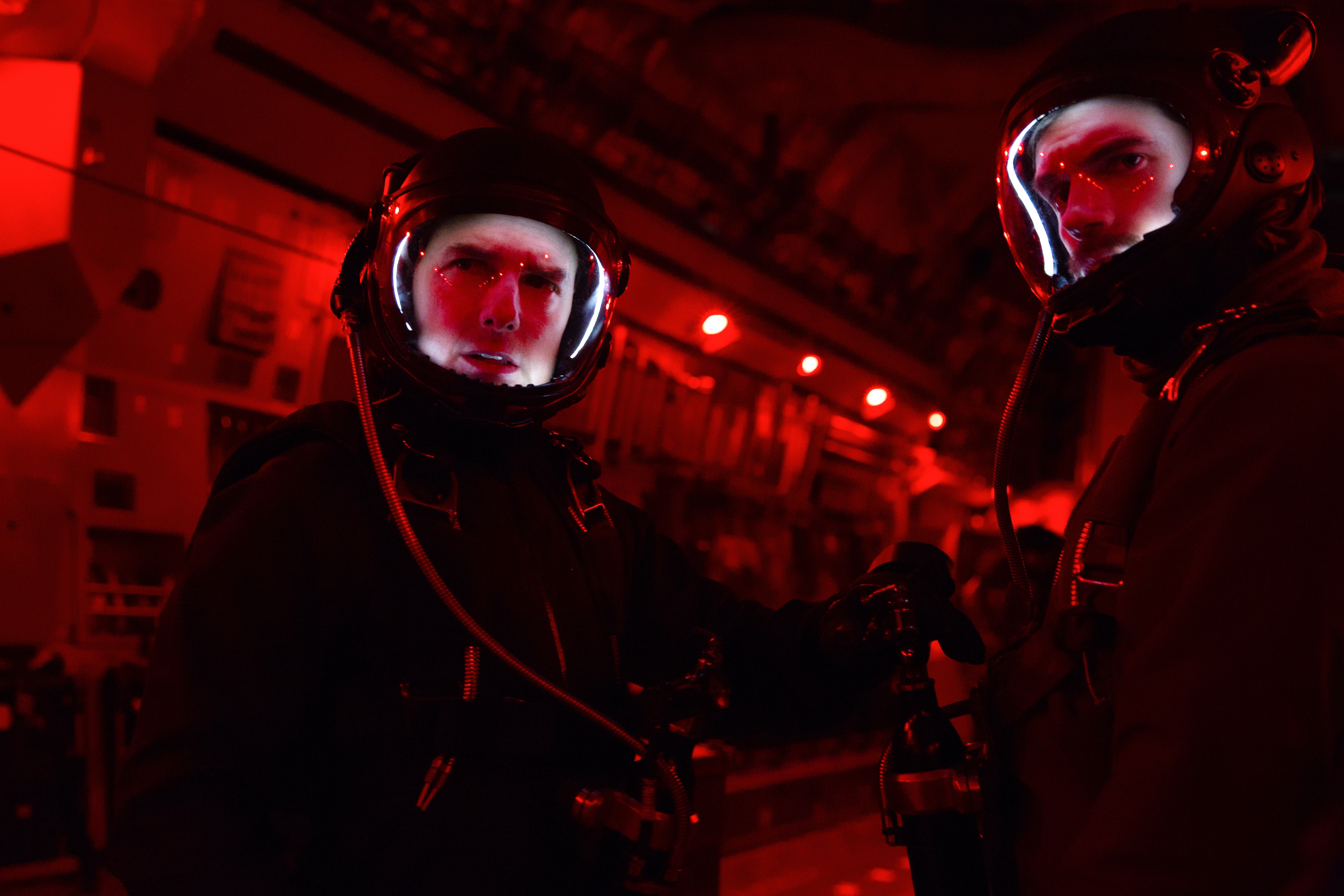 Ethan Hunt in a red-lit aircraft HD Wallpaper