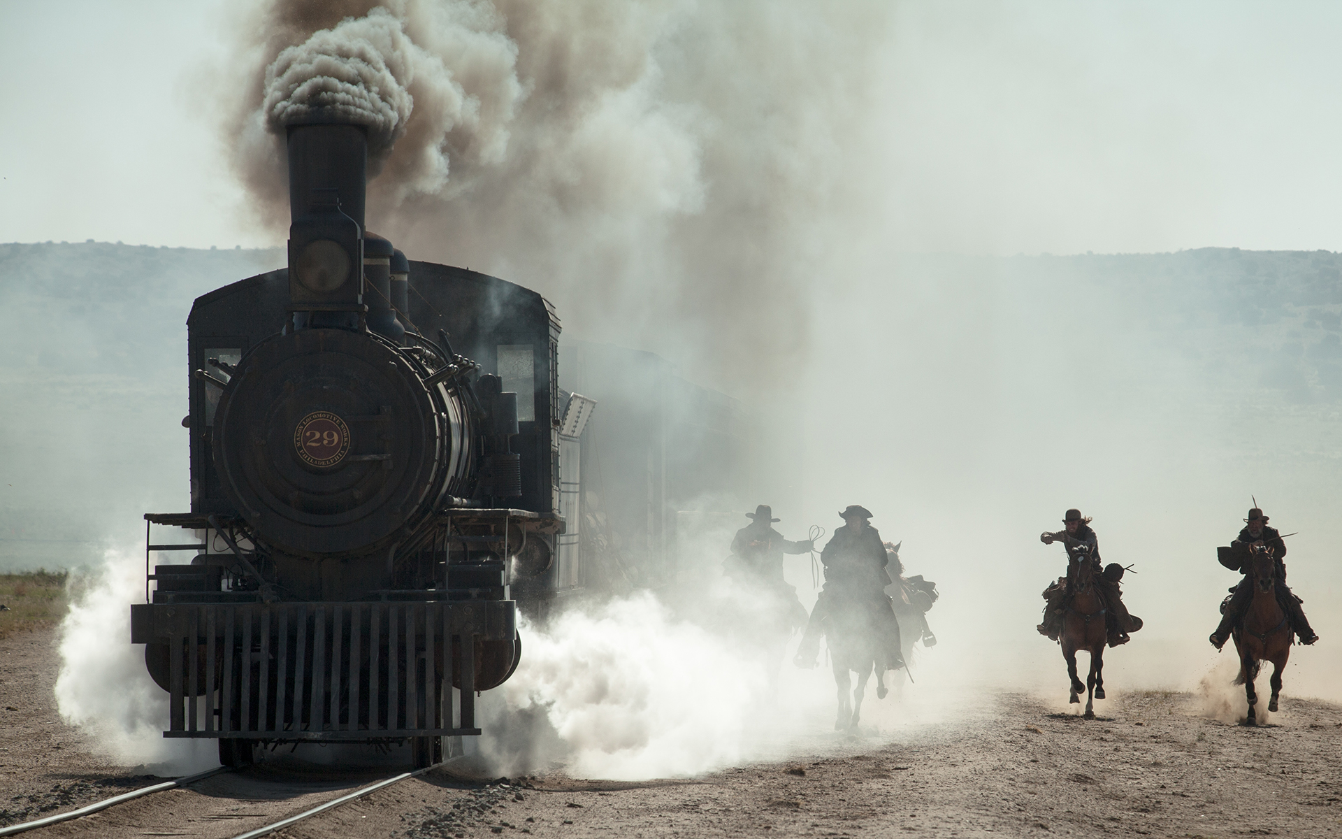 The Lone Ranger on horseback chasing a steam train HD Wallpaper