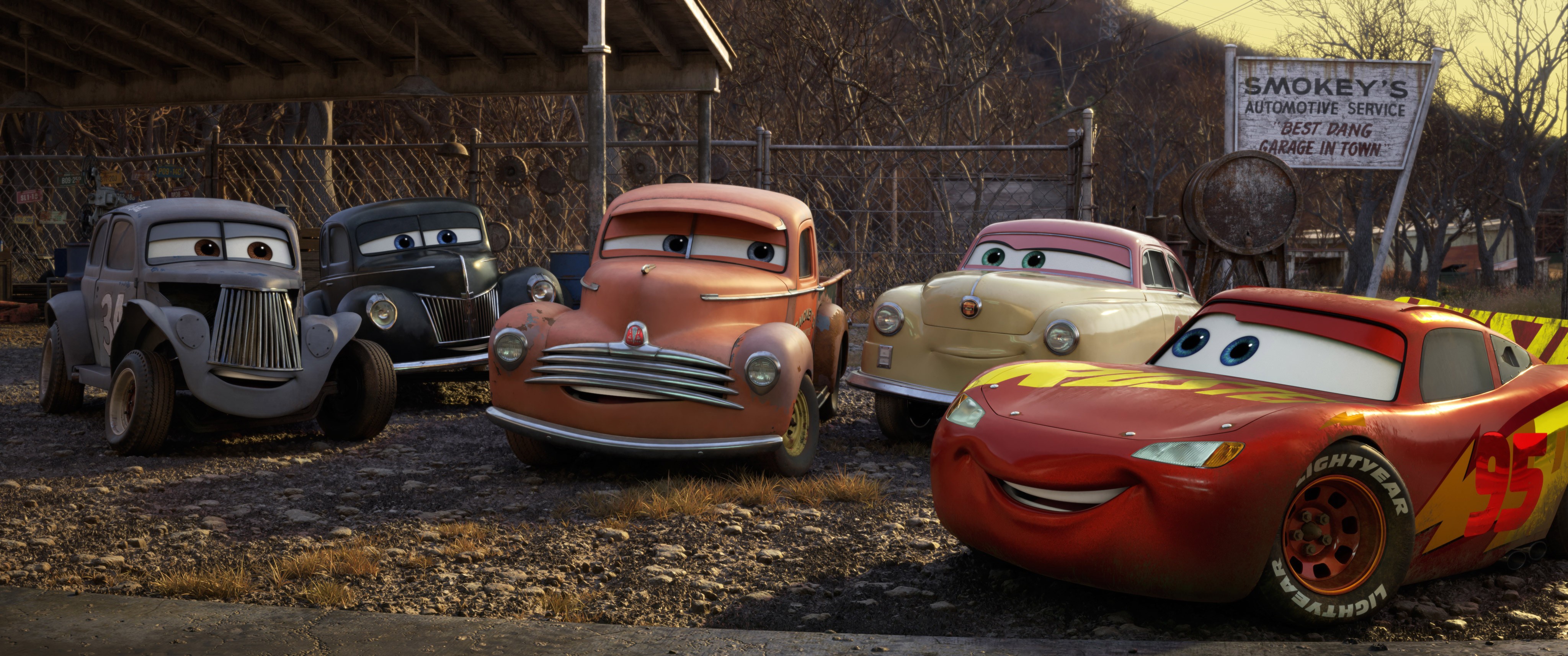 Lightning McQueen and friends at Smokey's Garage HD Wallpaper