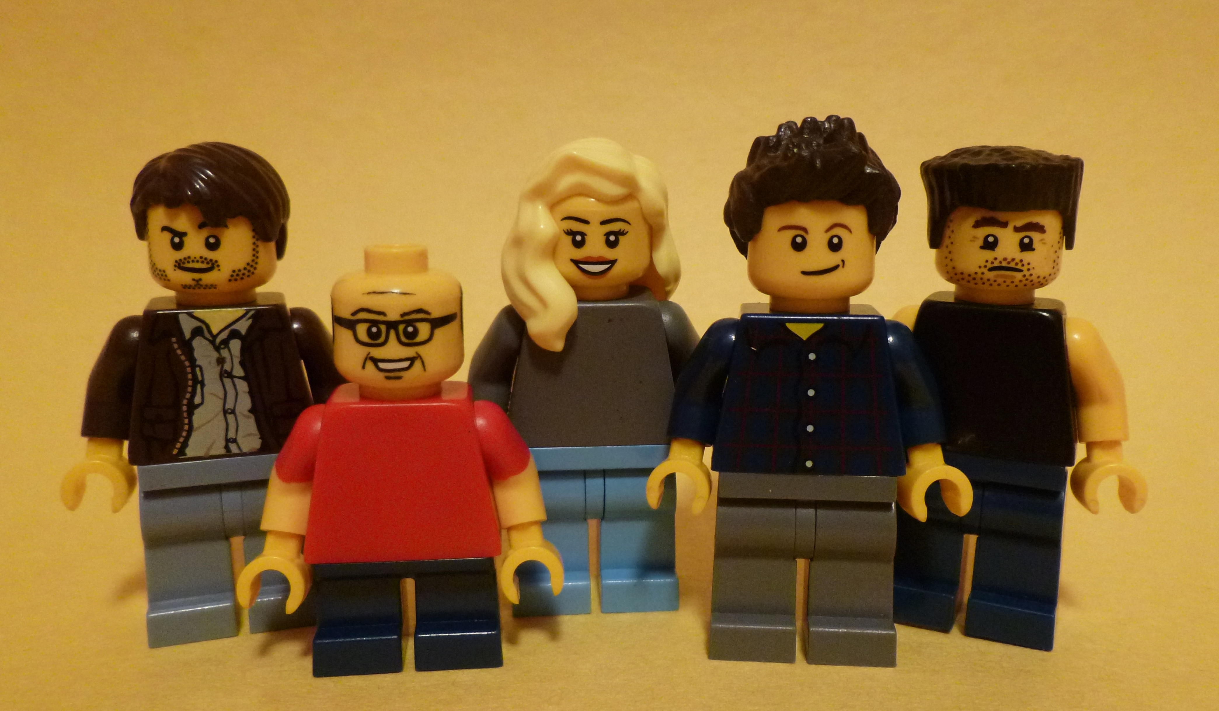 Five Lego figures, one resembling Charlie Kelly HD Wallpaper