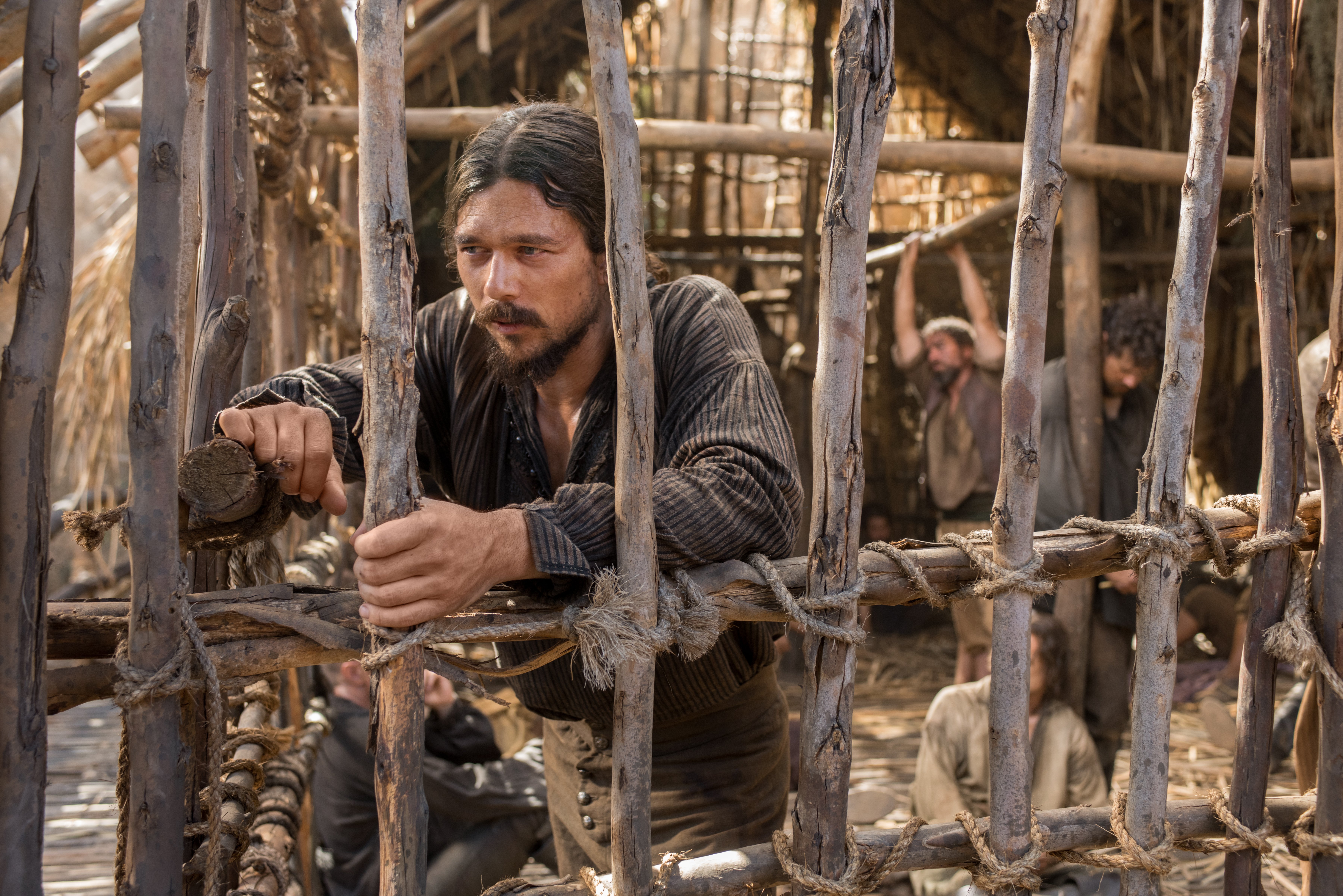 John Silver from Black Sails in a wooden enclosure HD Wallpaper