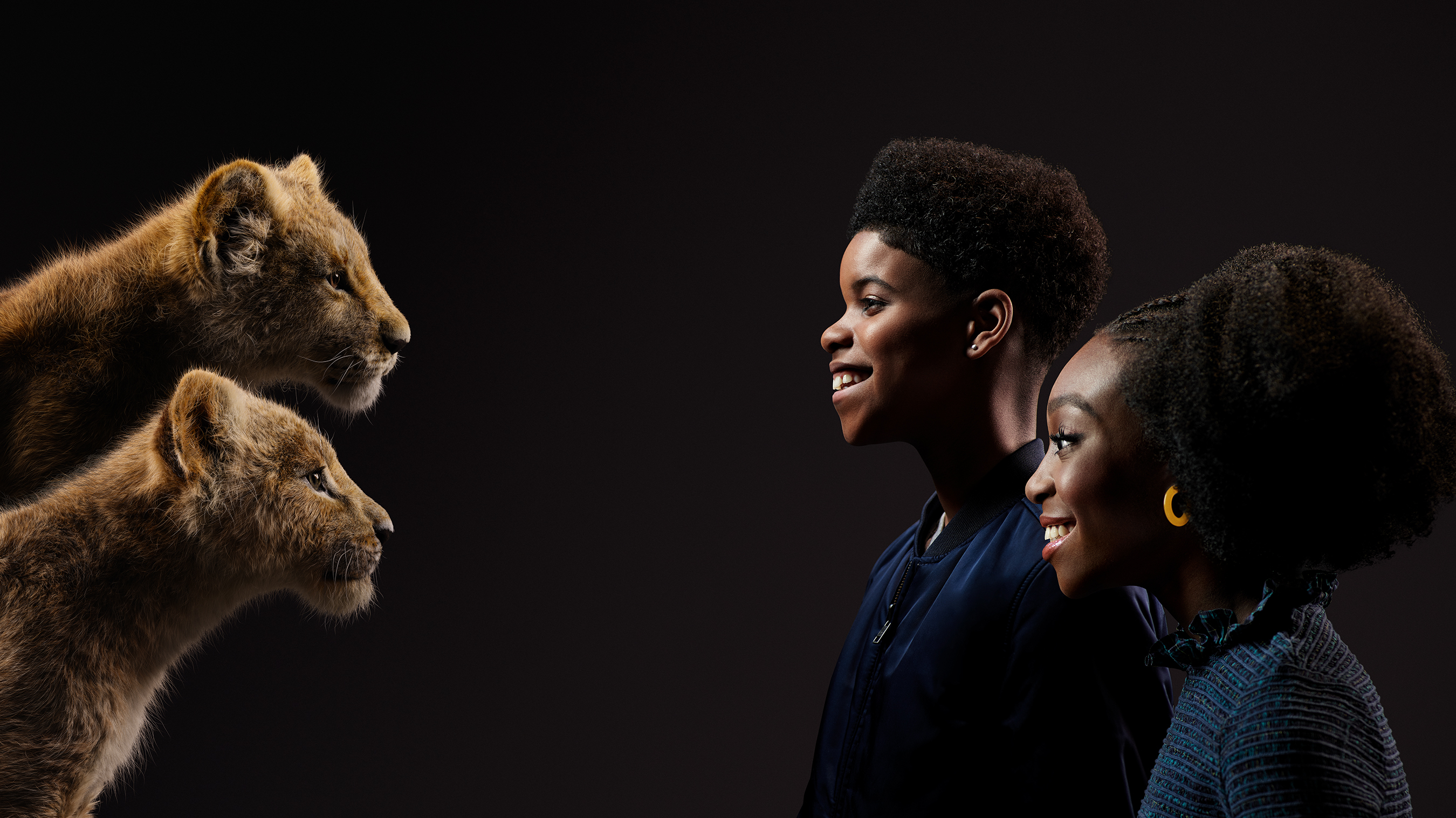Two lion cubs and two children HD Wallpaper