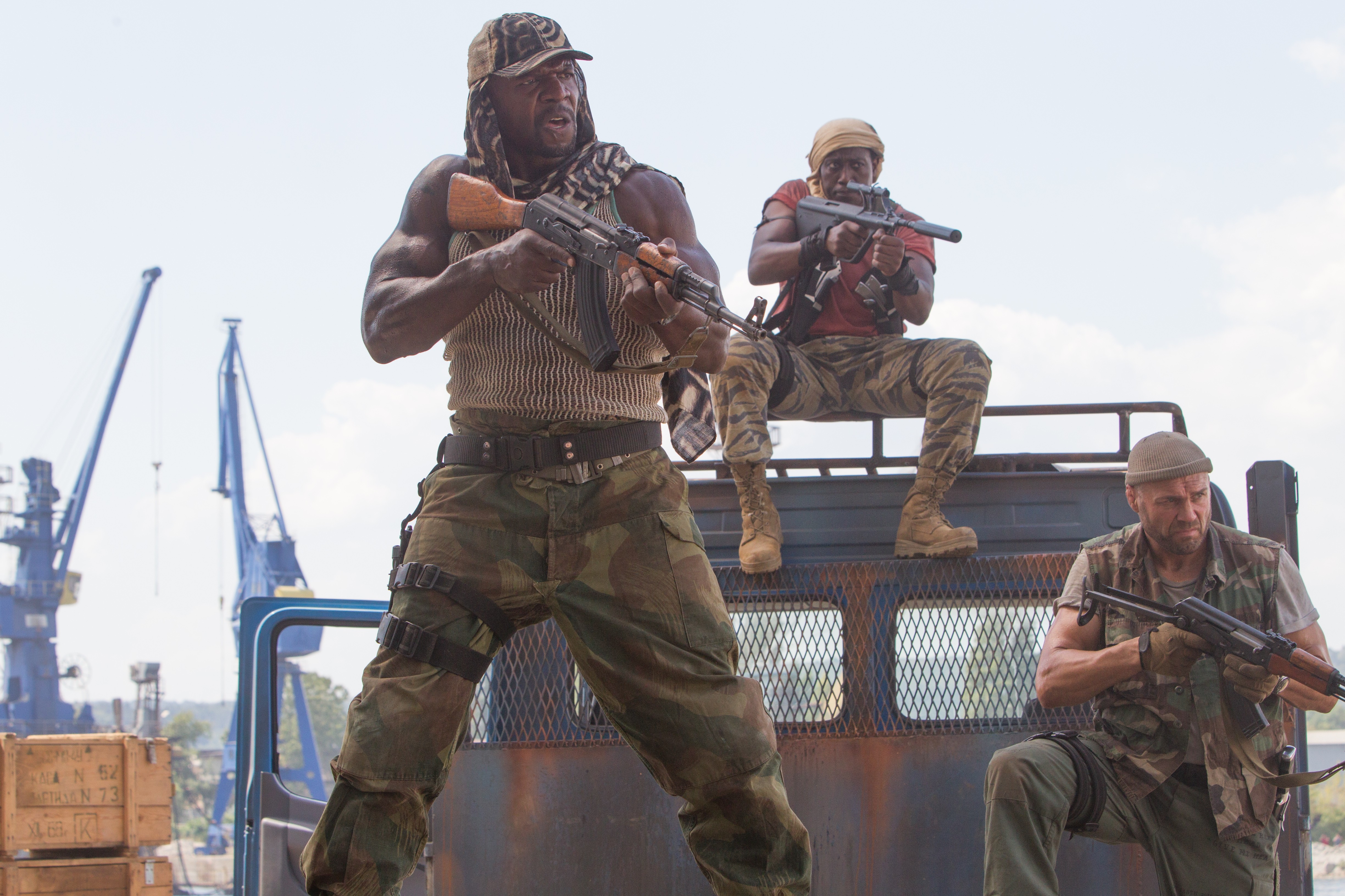 Three armed men on a truck HD Wallpaper