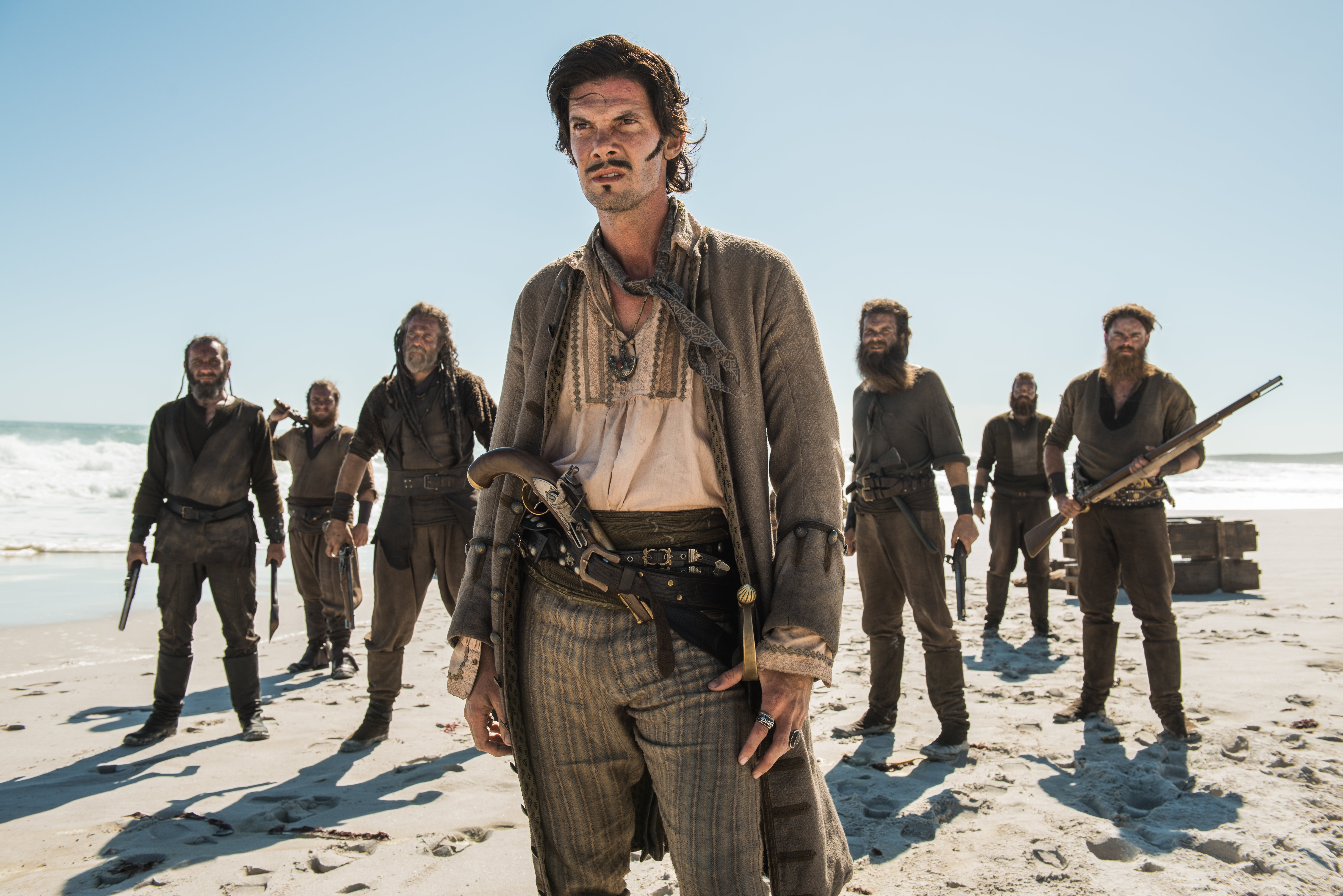 Captain Jack Rackham and his crew on a beach HD Wallpaper