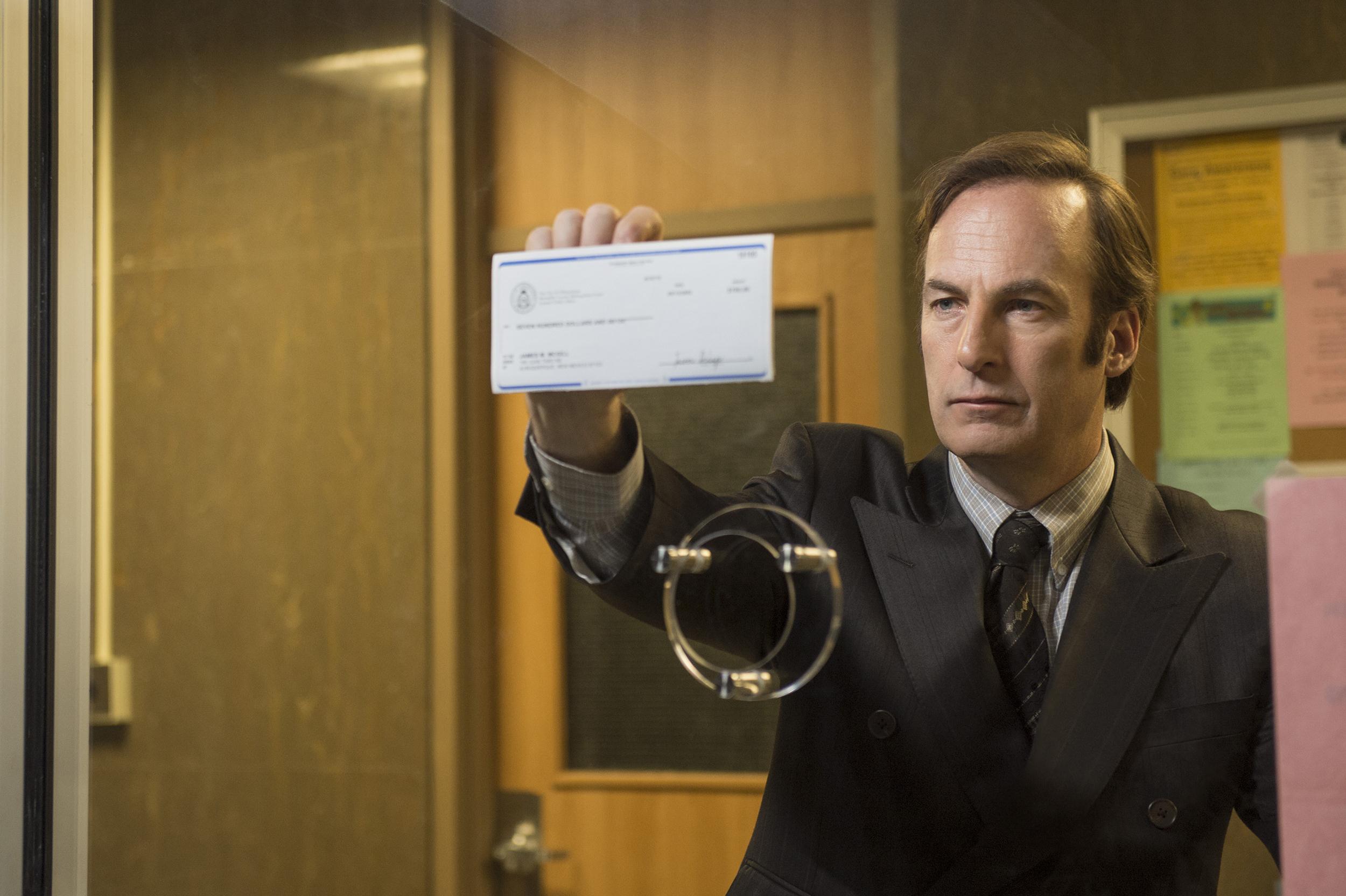 Jimmy McGill holding a check HD Wallpaper