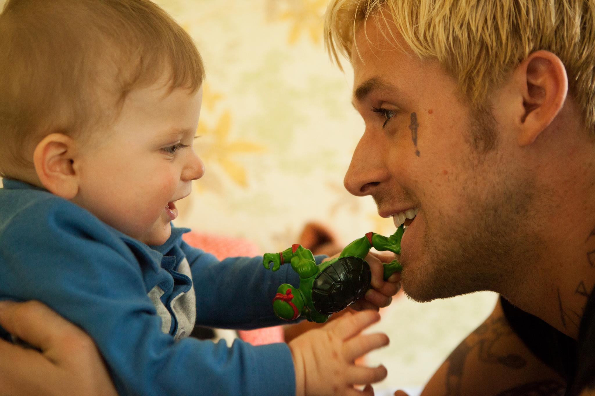 Luke from The Place Beyond the Pines with a baby HD Wallpaper