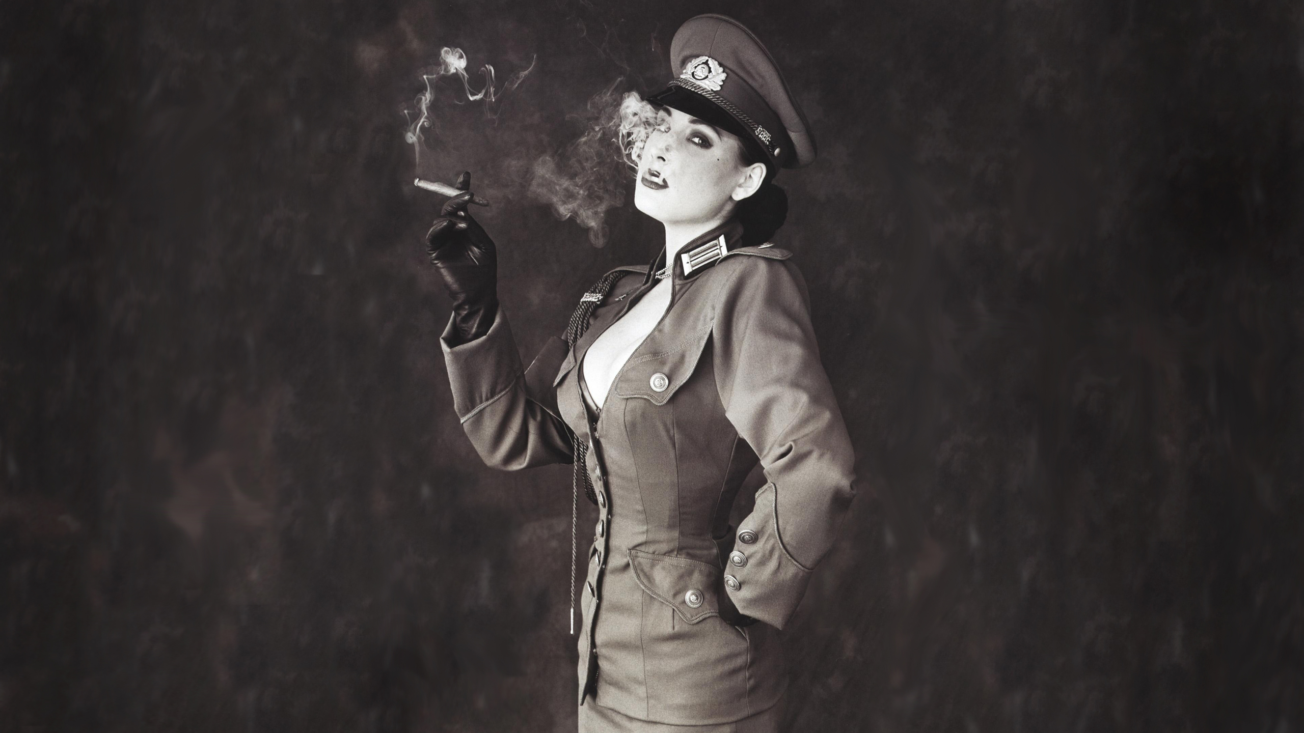 Dita Von Teese in military-style uniform smoking cigar HD Wallpaper