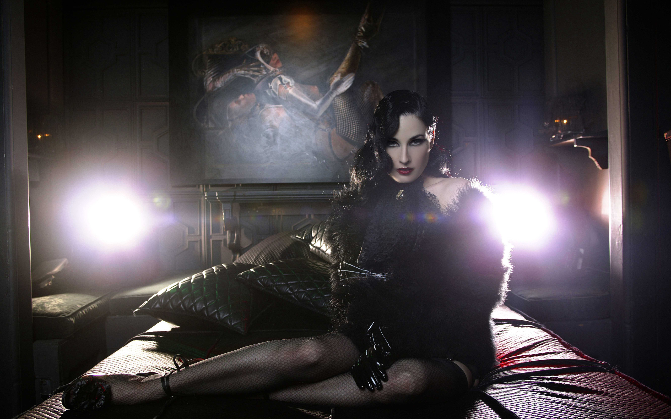 Dita Von Teese in a black outfit on a bed HD Wallpaper