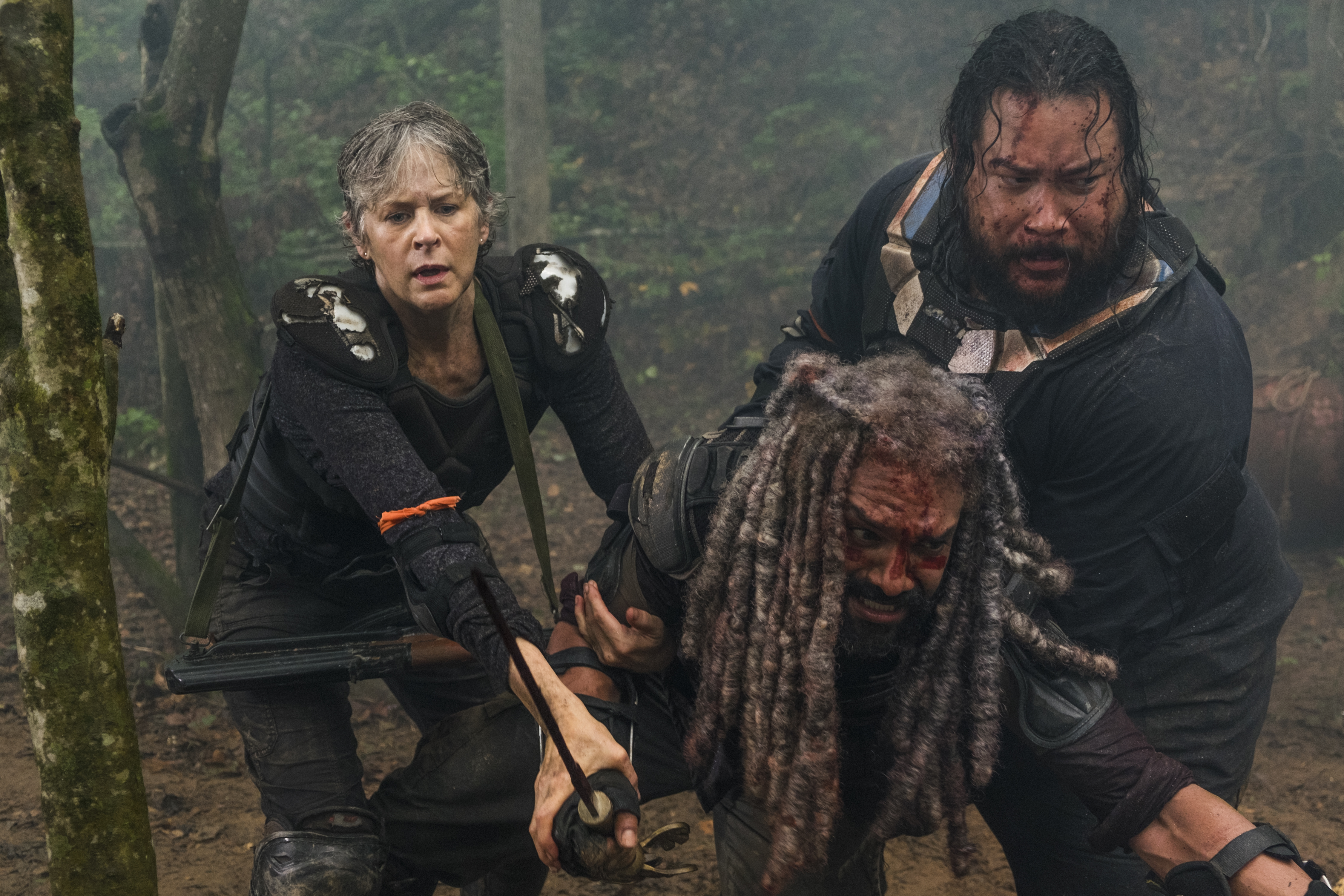 Carol Peletier and companions in a forest HD Wallpaper
