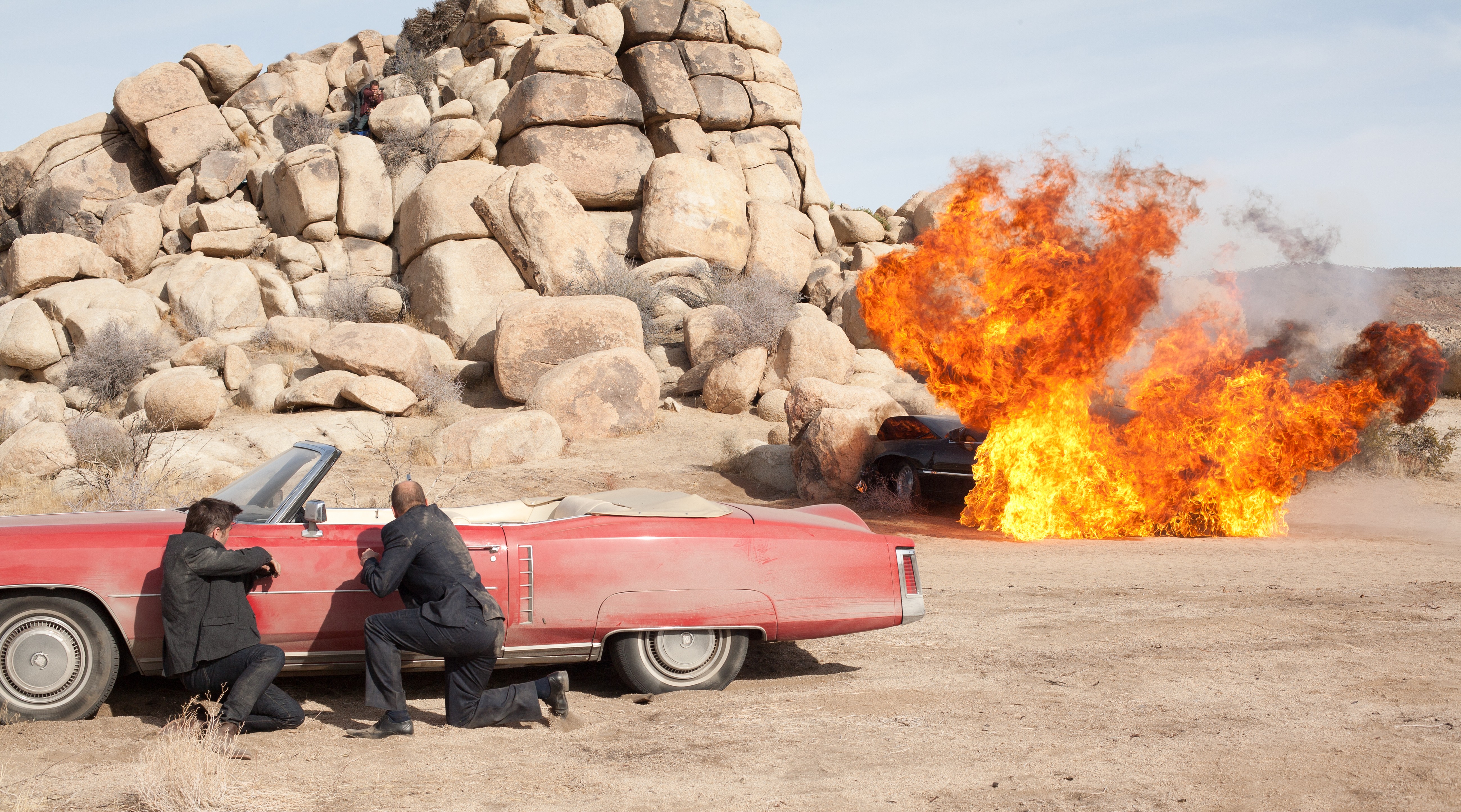 Marty from Seven Psychopaths in a desert car explosion HD Wallpaper