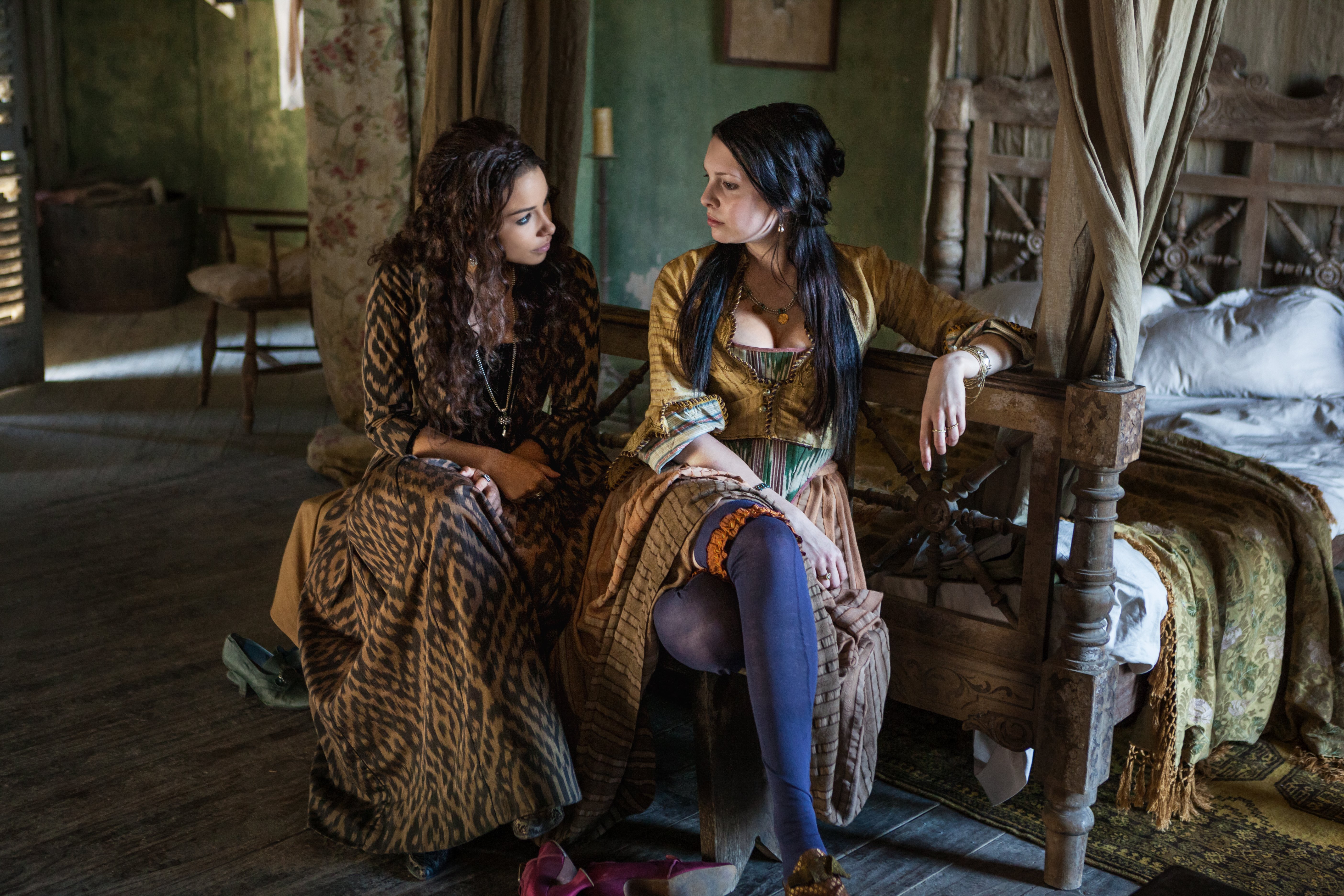 Two women in period clothing in a bedroom HD Wallpaper