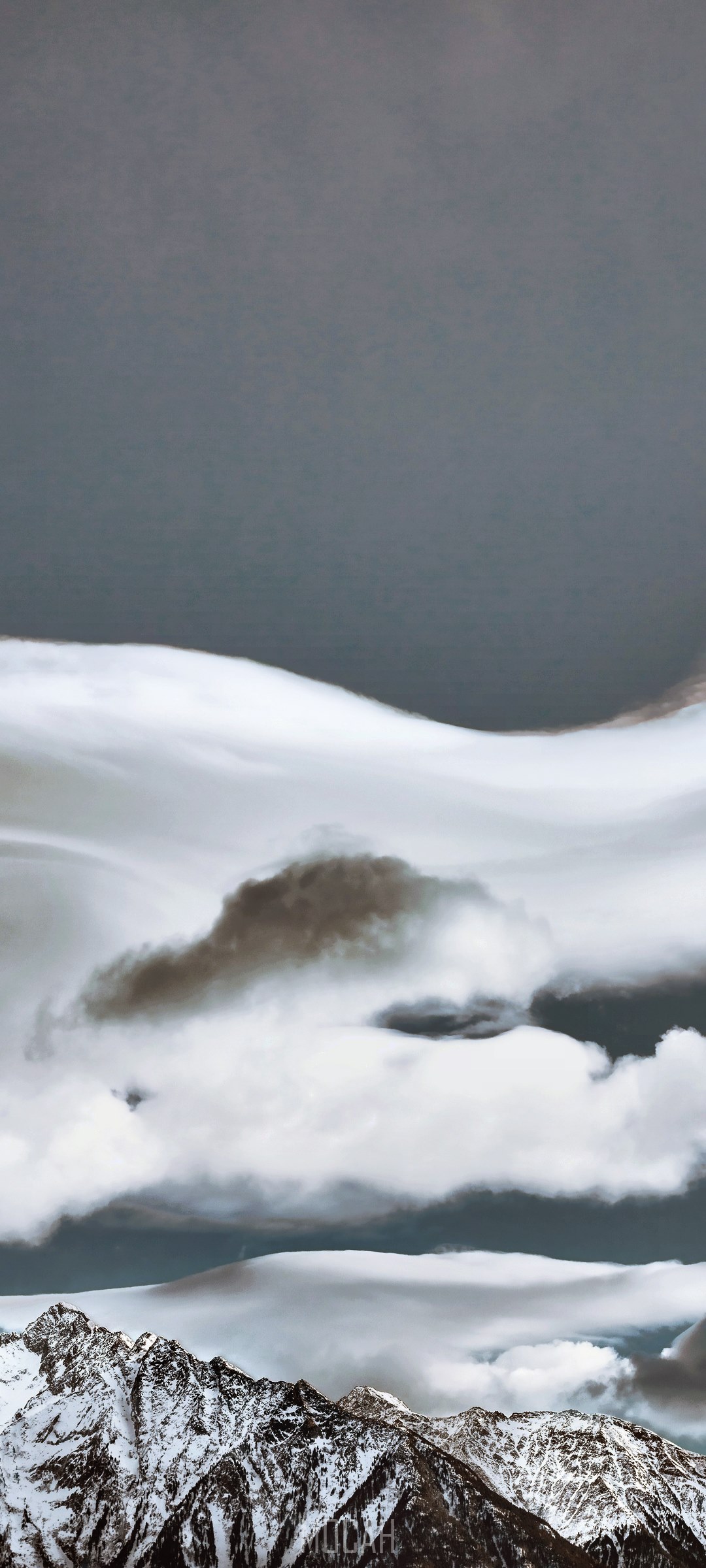Snowy mountains under dramatic clouds HD Phone Wallpaper