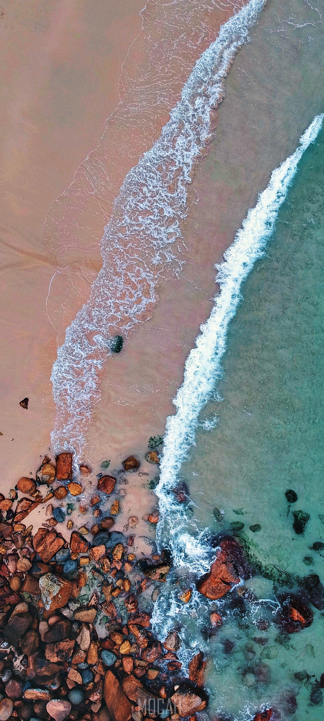 Aerial view of a rocky beach with waves HD Phone Wallpaper