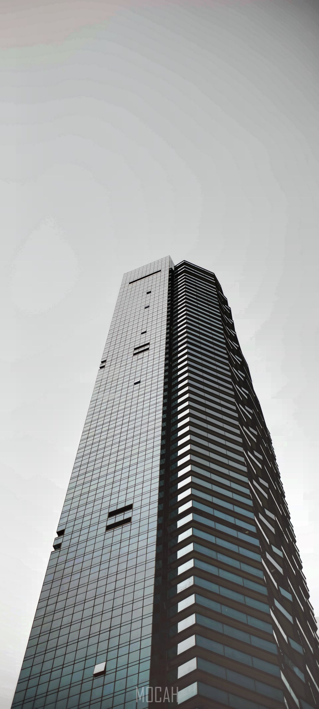 Tall skyscraper with black glass facade HD Phone Wallpaper