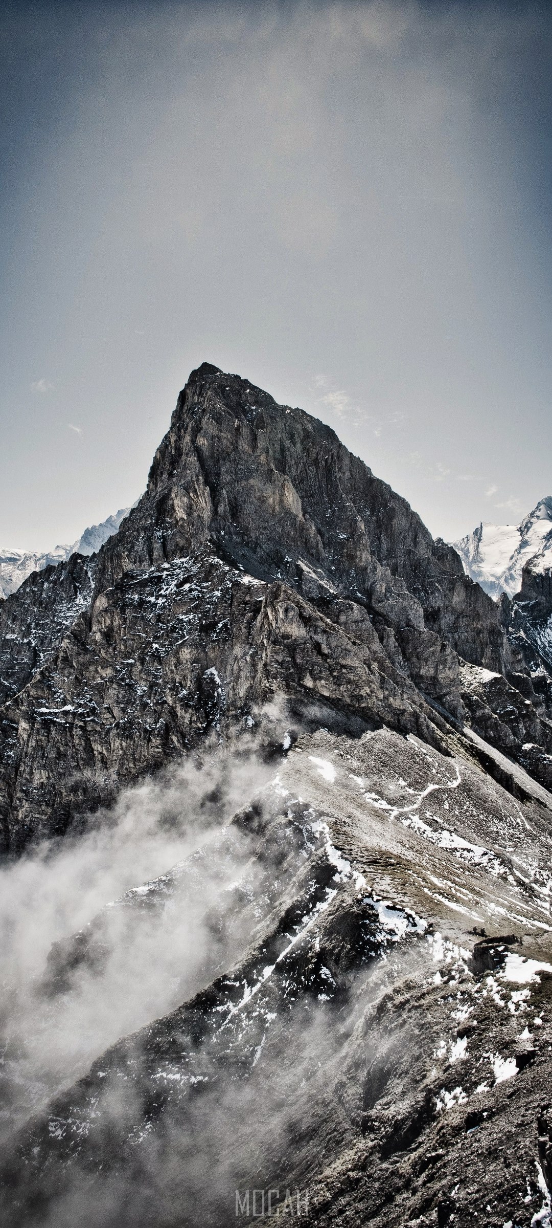 Misty fog wraps around snowy Bunderspitz mountain HD Phone Wallpaper