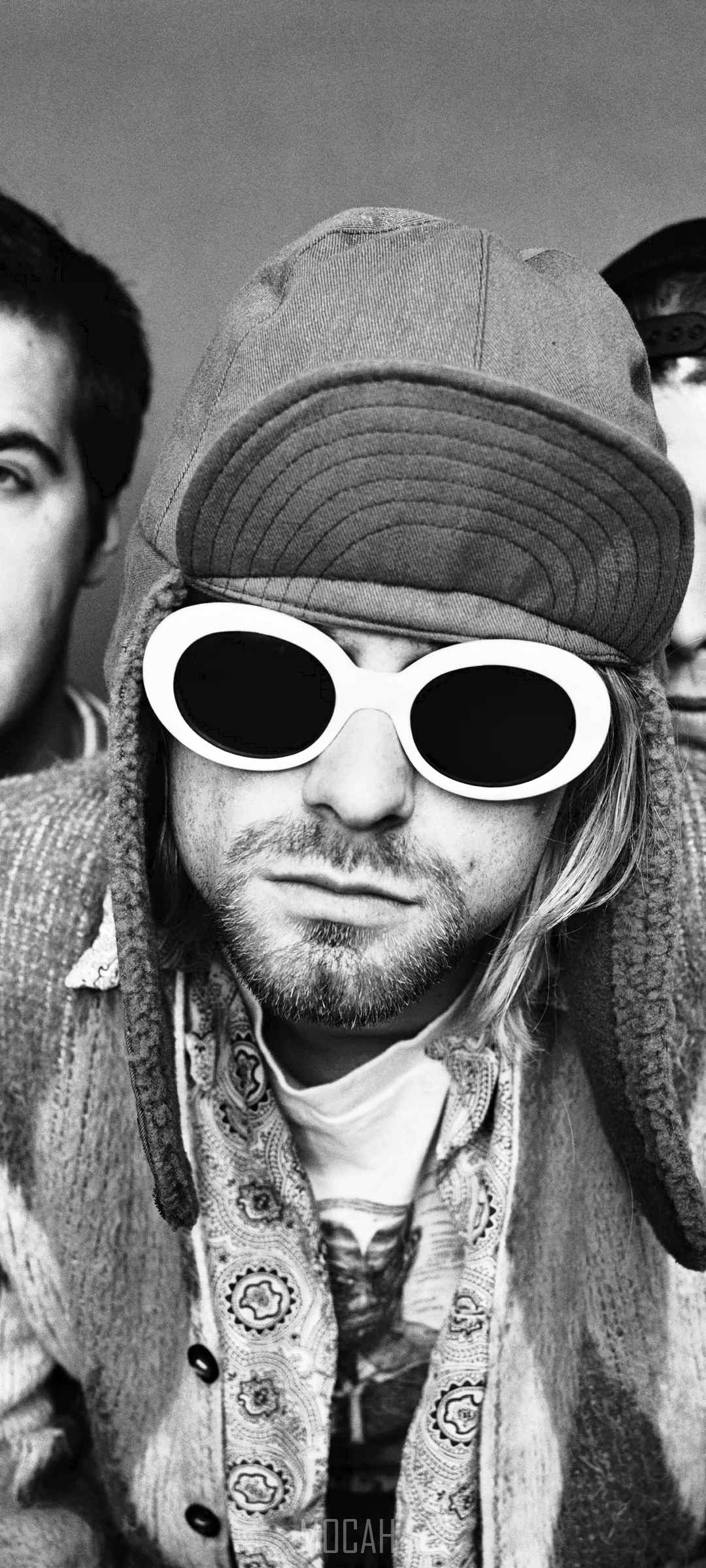 Kurt Cobain of Nirvana wearing sunglasses and a cap HD Phone Wallpaper