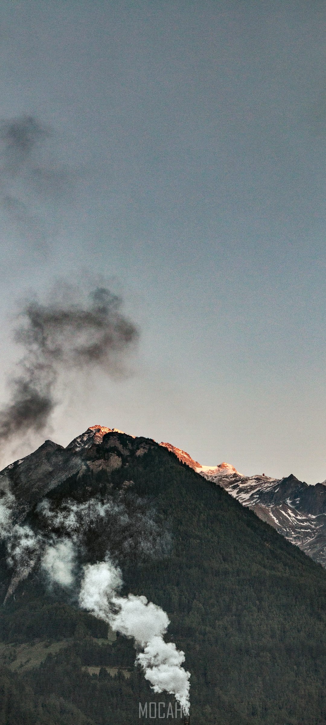 Mountain peak with smoke and snow HD Phone Wallpaper