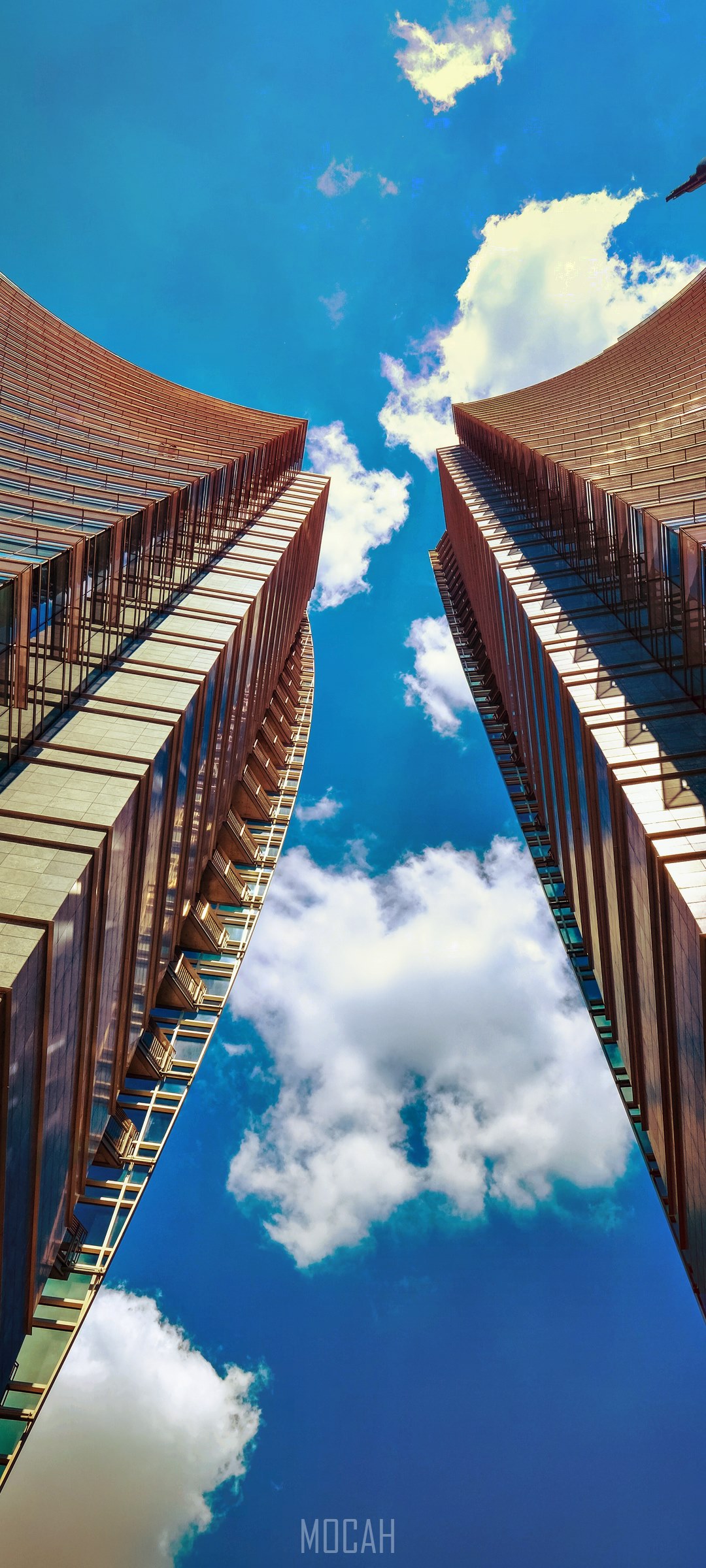 Two modern skyscrapers against a blue sky with clouds HD Phone Wallpaper