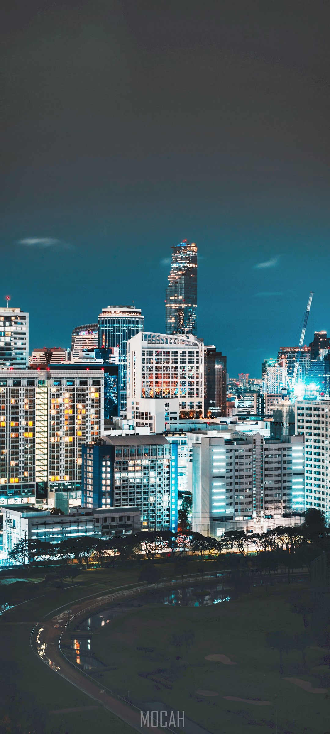 Night cityscape with illuminated skyscrapers and a park HD Phone Wallpaper