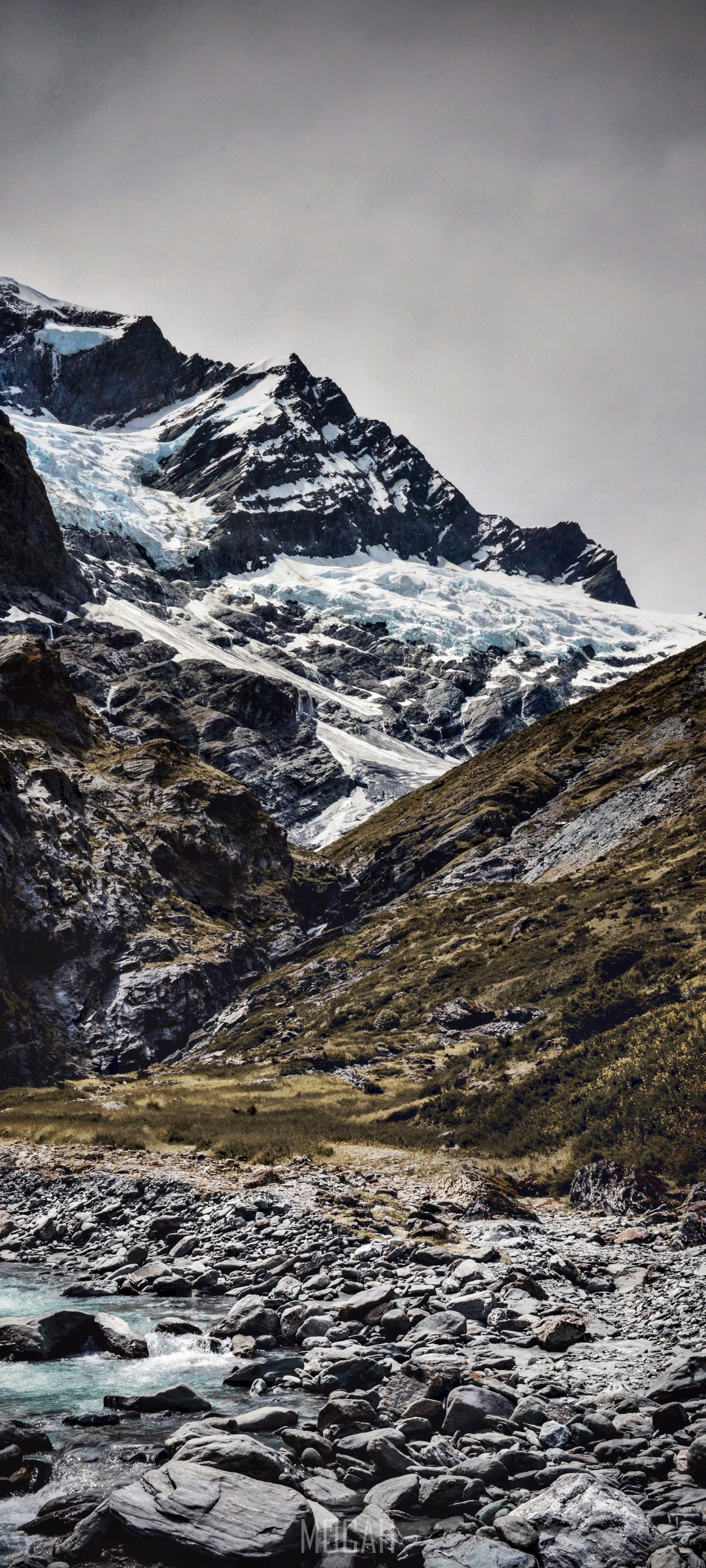 Rugged mountain landscape with glacier and rocky riverbed HD Phone Wallpaper