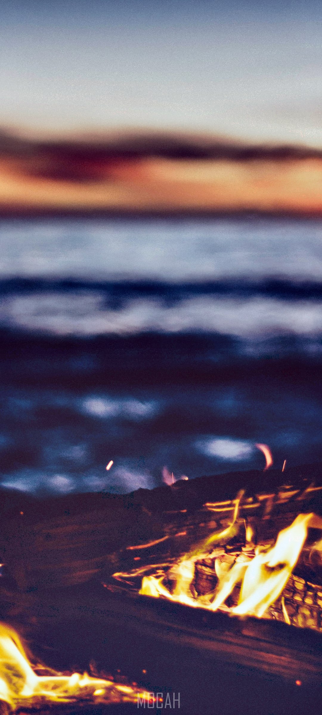 Bonfire on the beach at sunset HD Phone Wallpaper