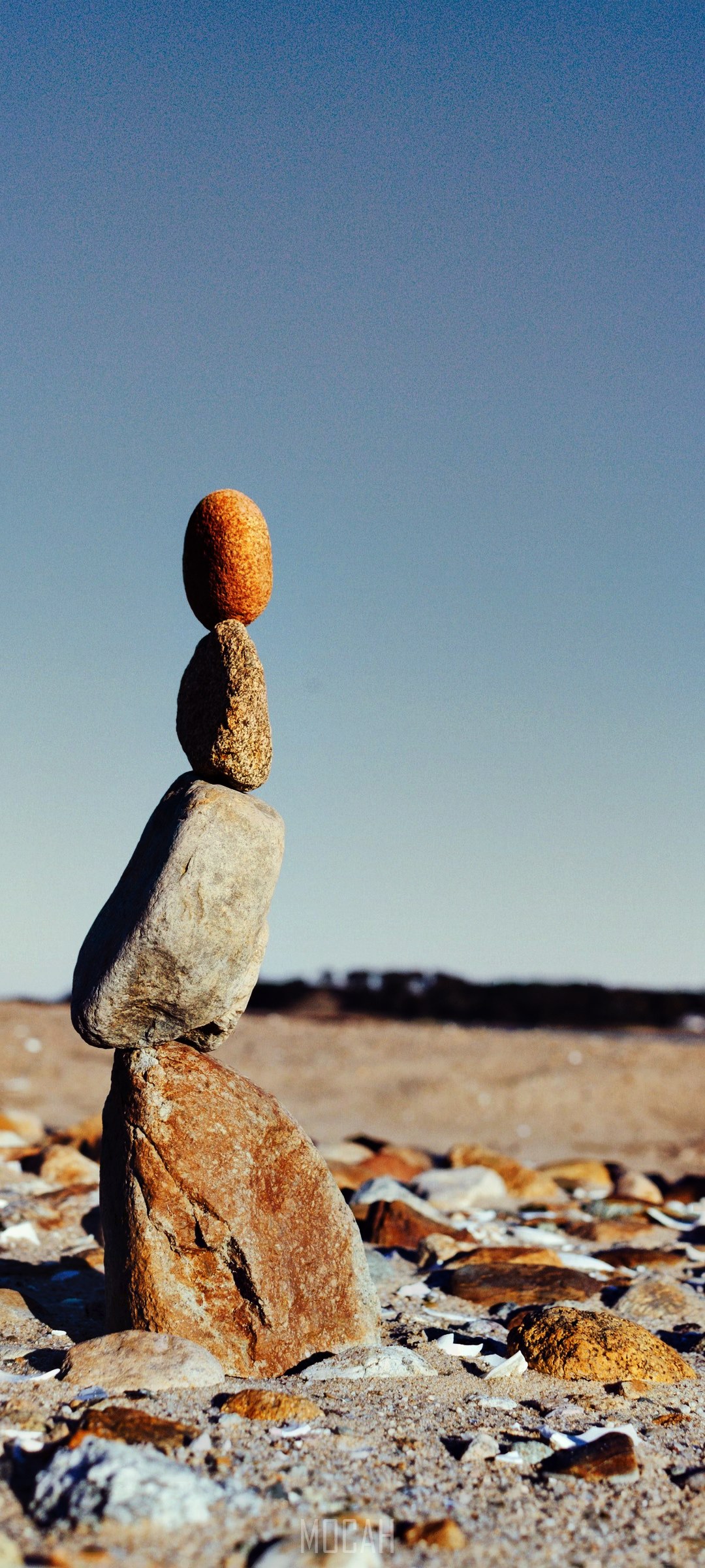 Balanced stones on a beach HD Phone Wallpaper