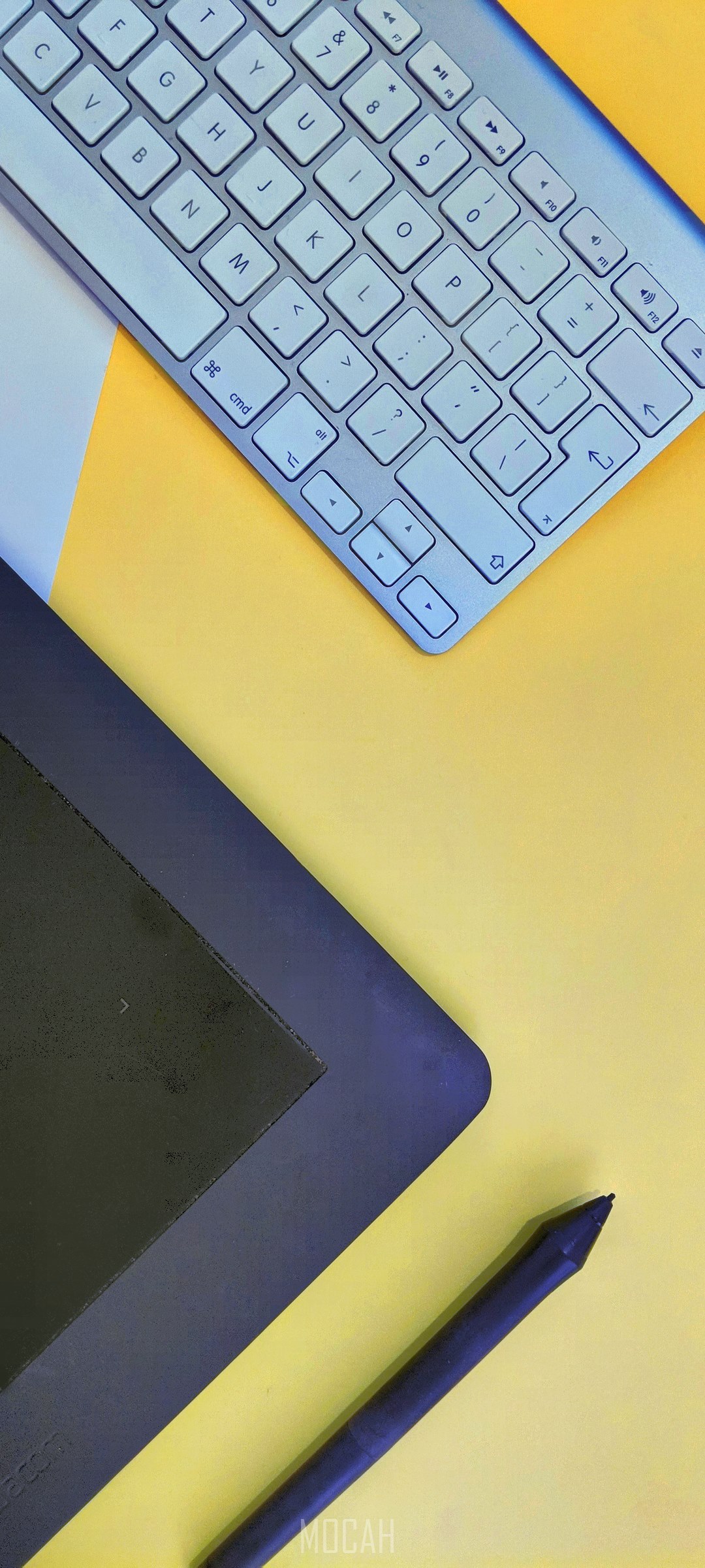 Keyboard, drawing tablet, and stylus on yellow background HD Phone Wallpaper
