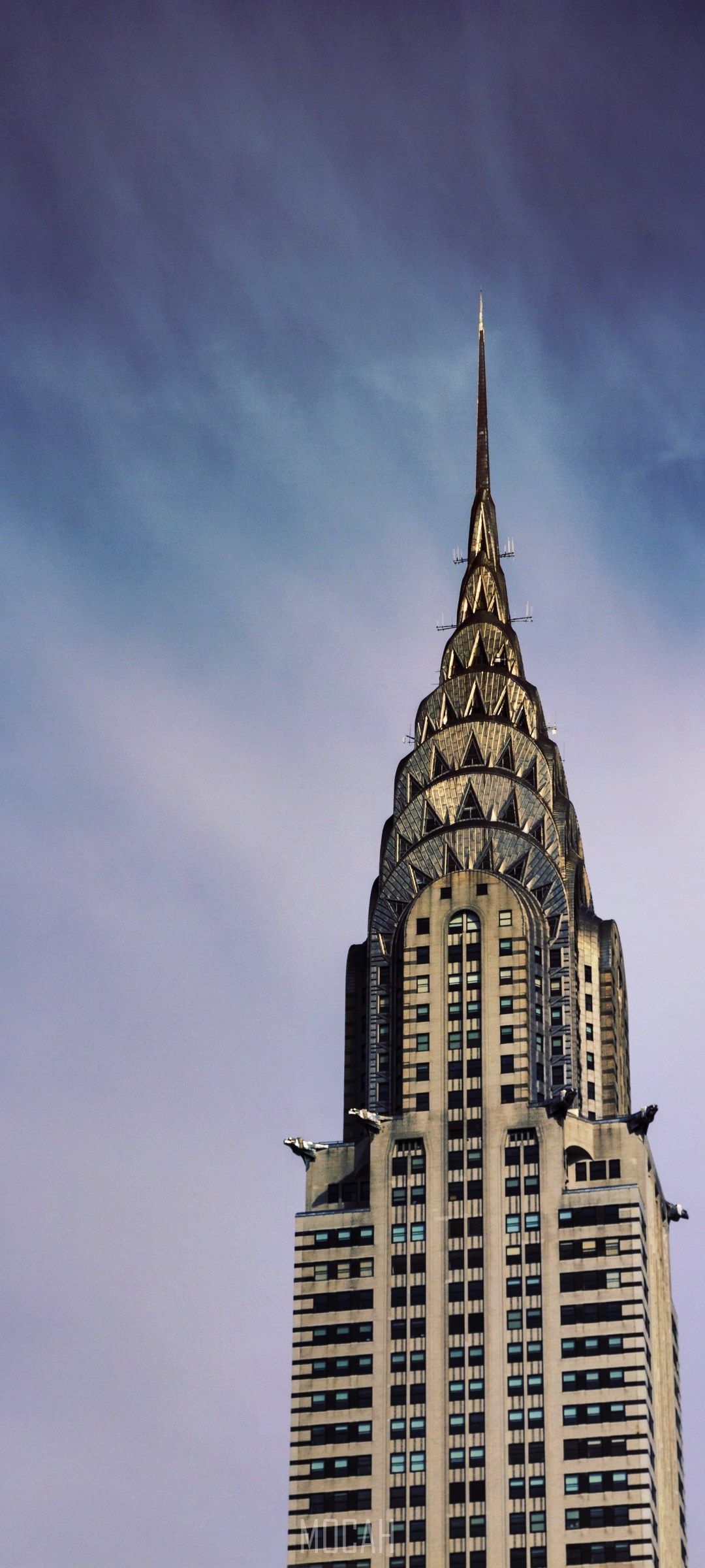 Chrysler Building spire against a cloudy sky HD Phone Wallpaper