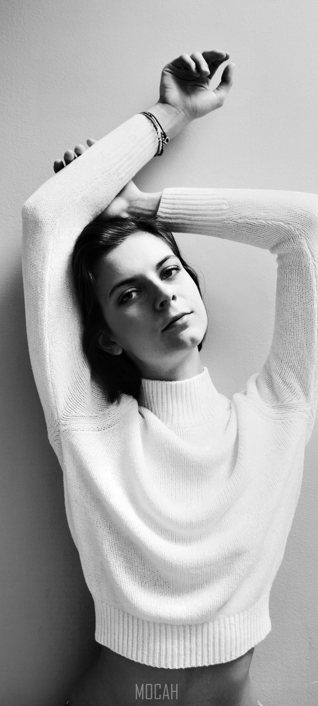 Woman in white sweater with arms raised HD Phone Wallpaper