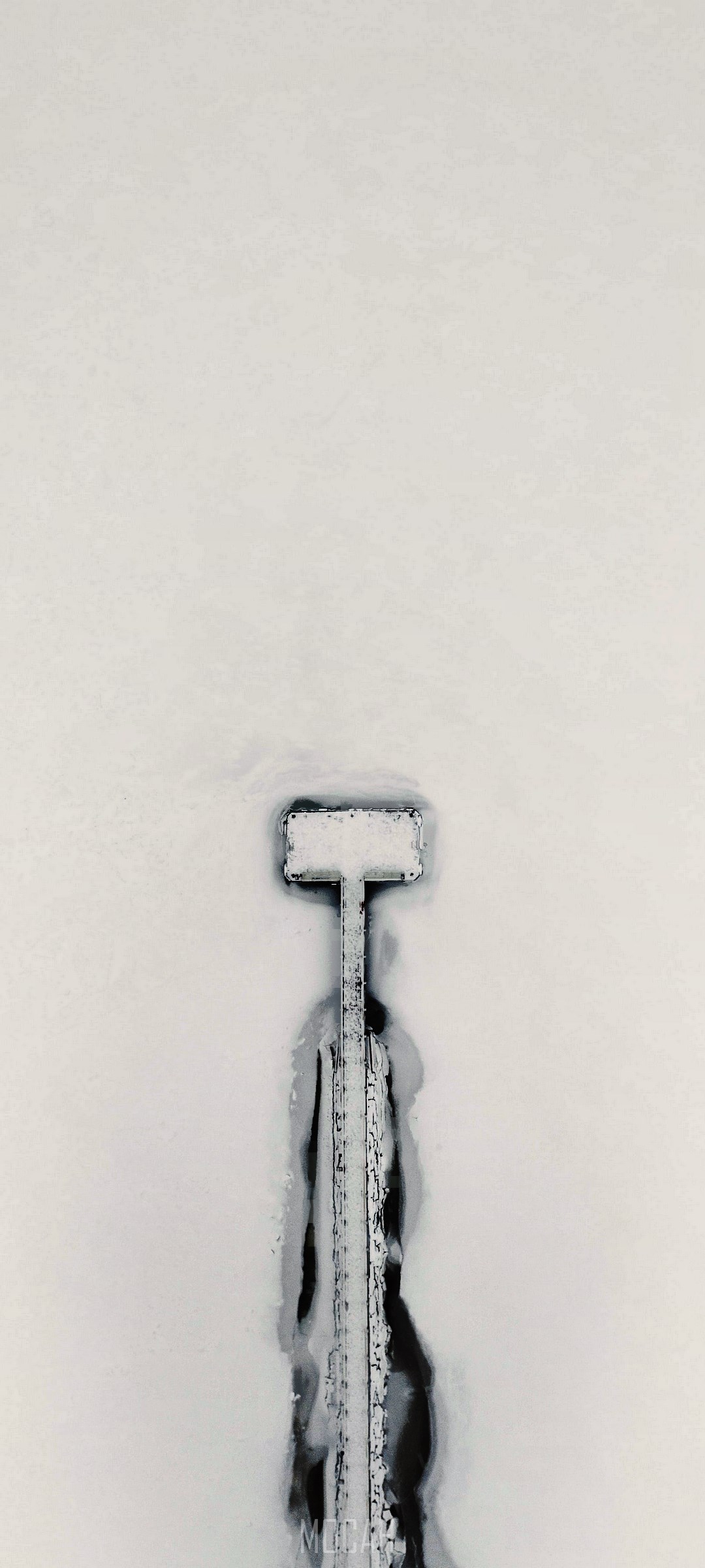 Aerial view of a snow-covered pier on a frozen body of water HD Phone Wallpaper